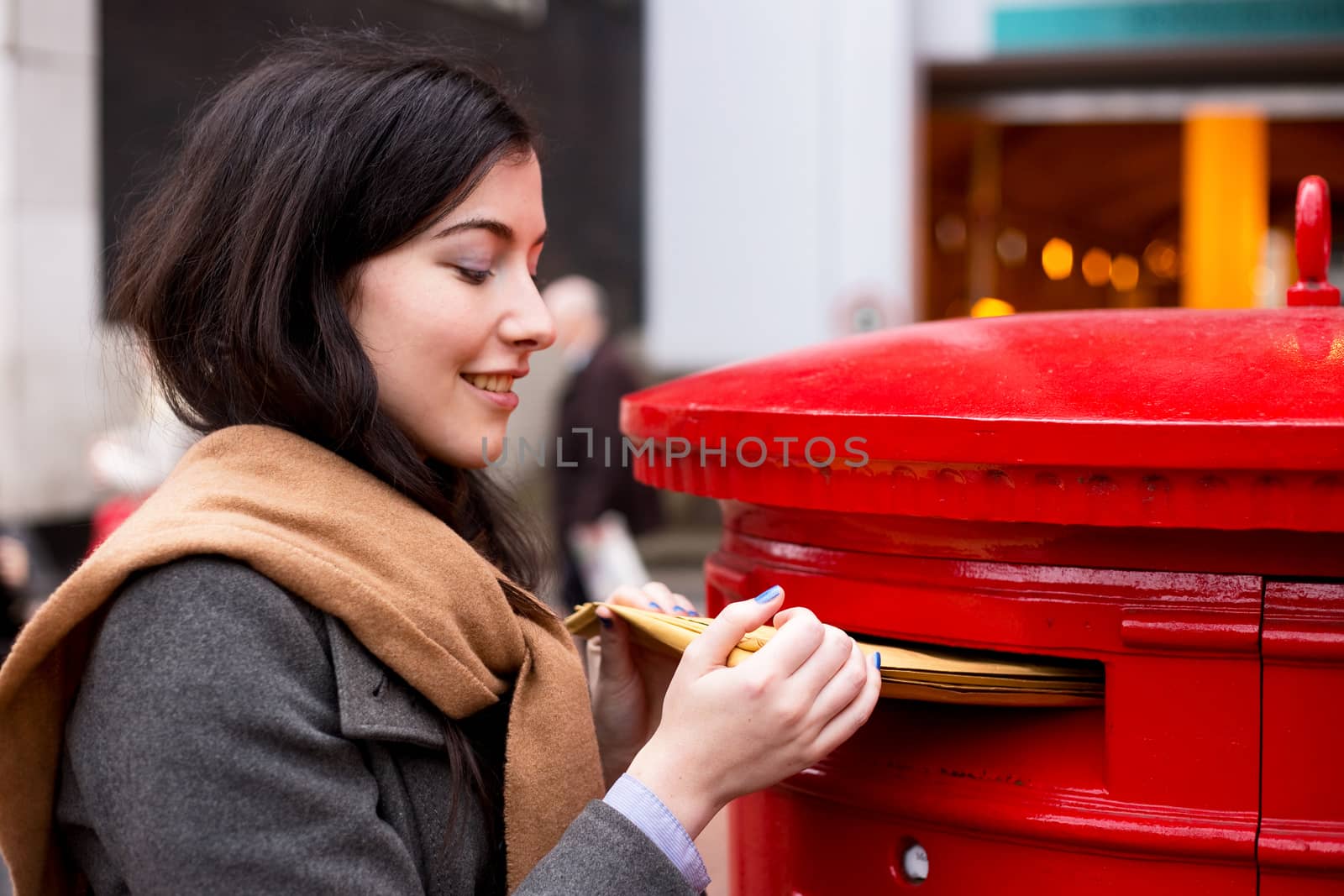 young woman posting letters