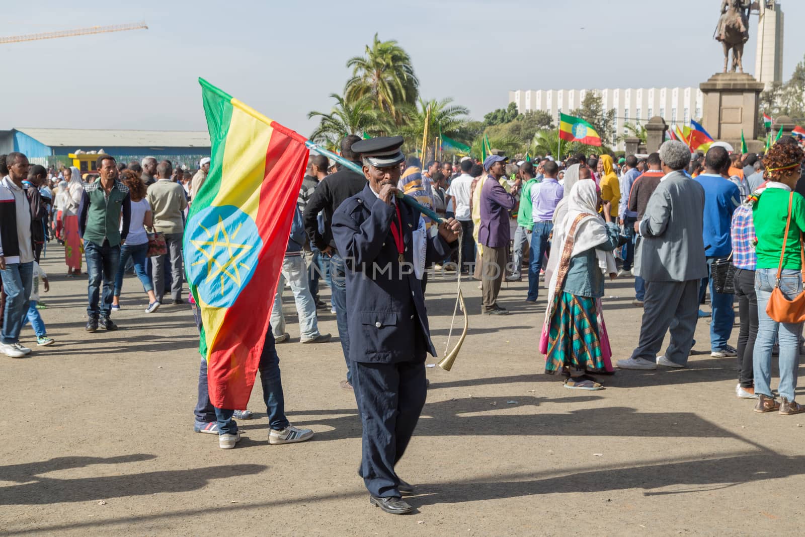 A war veteran carries a large Ethiopian flag at the 119th Annive by derejeb