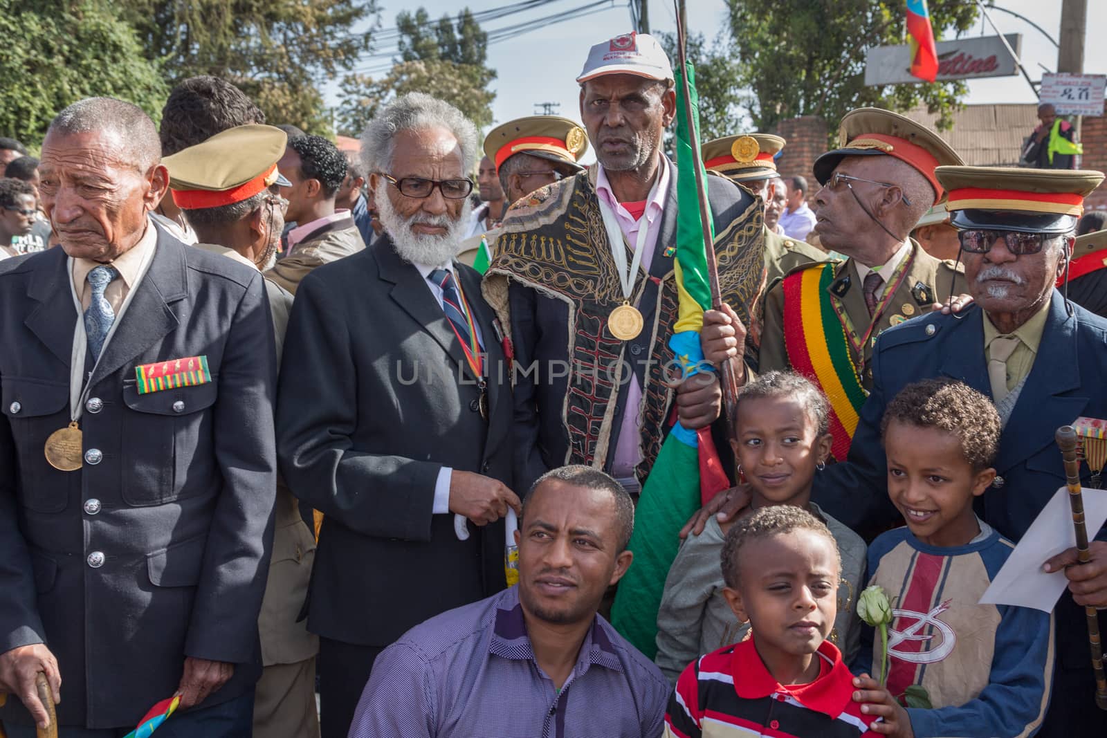 Young children pose to take pictures with the war veterans  by derejeb