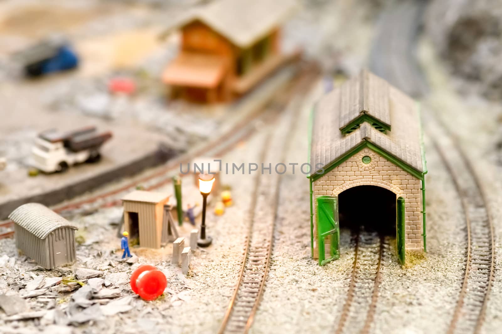 miniature train set engine shed and trackdise detail with shallow d.o.f