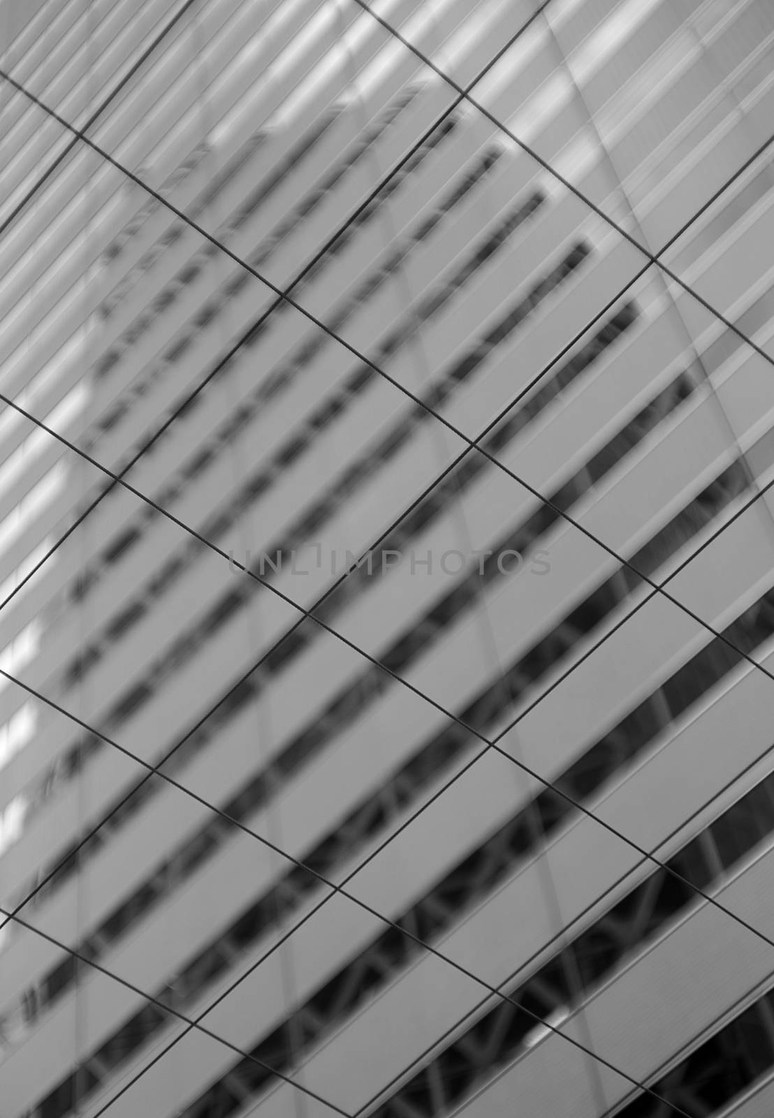 Reflection of the Cocoon Tower through the grid.
