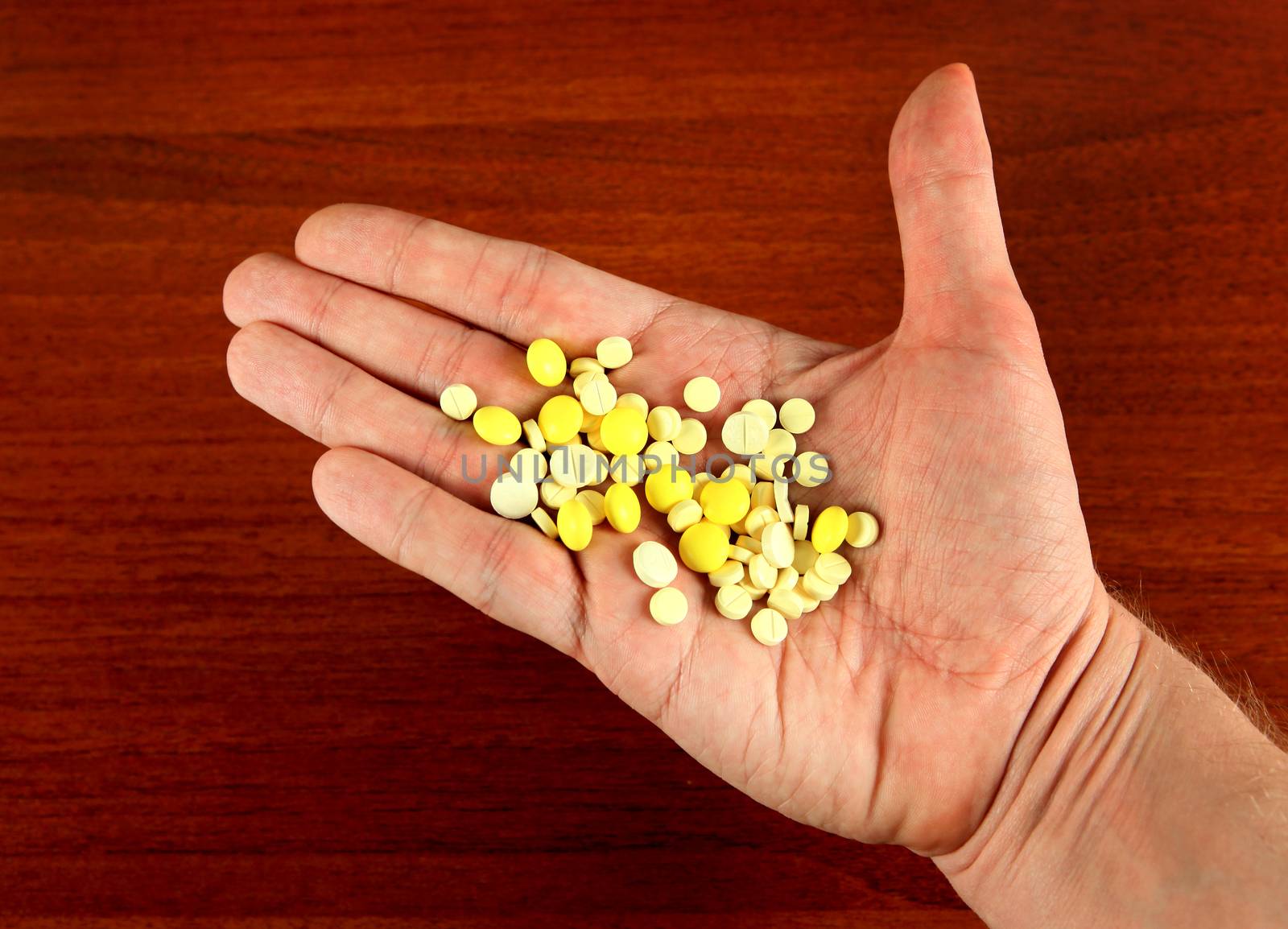 A Lot of the Pills on the Hand closeup