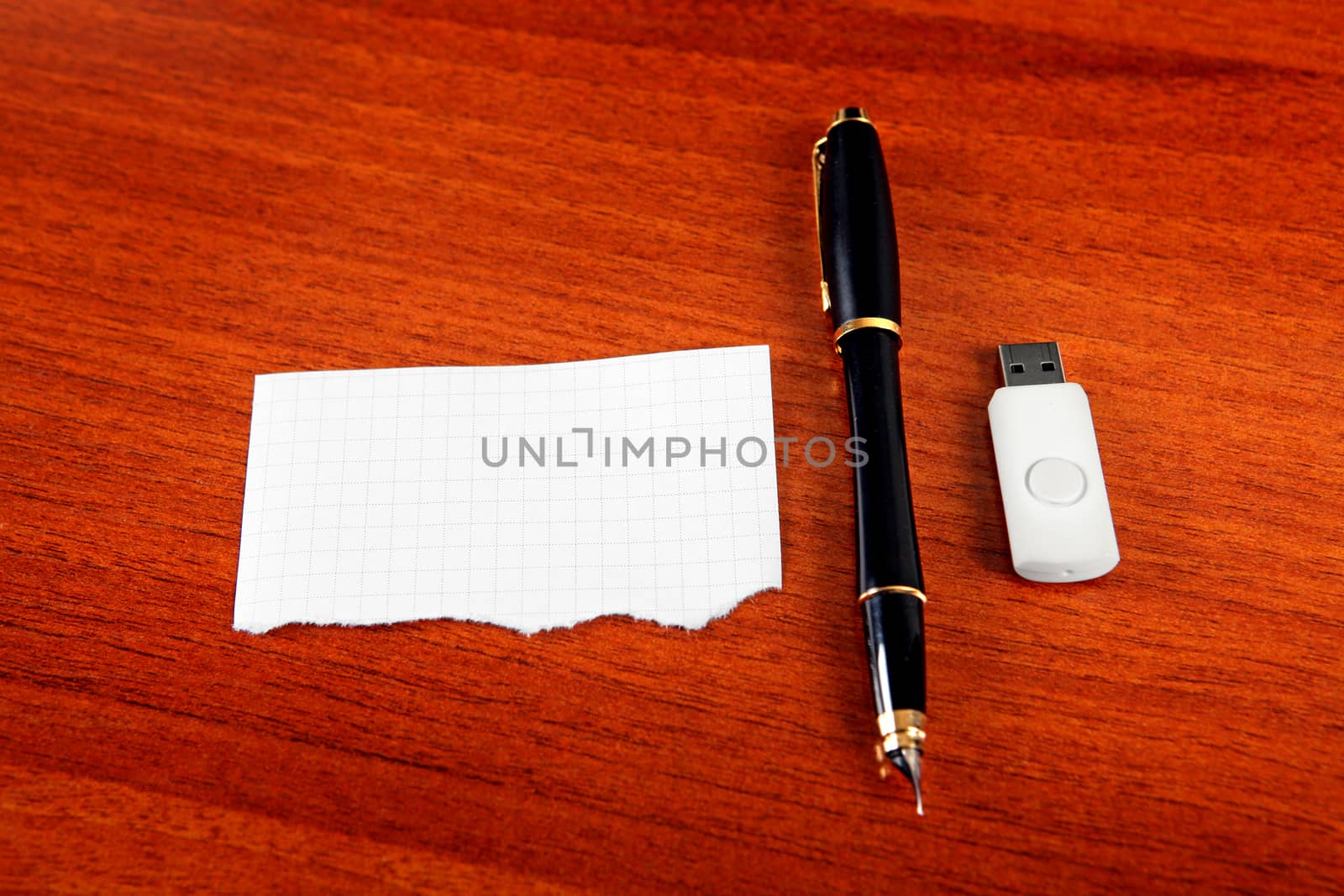 Empty Paper with the Pen and USB Drive on The Table
