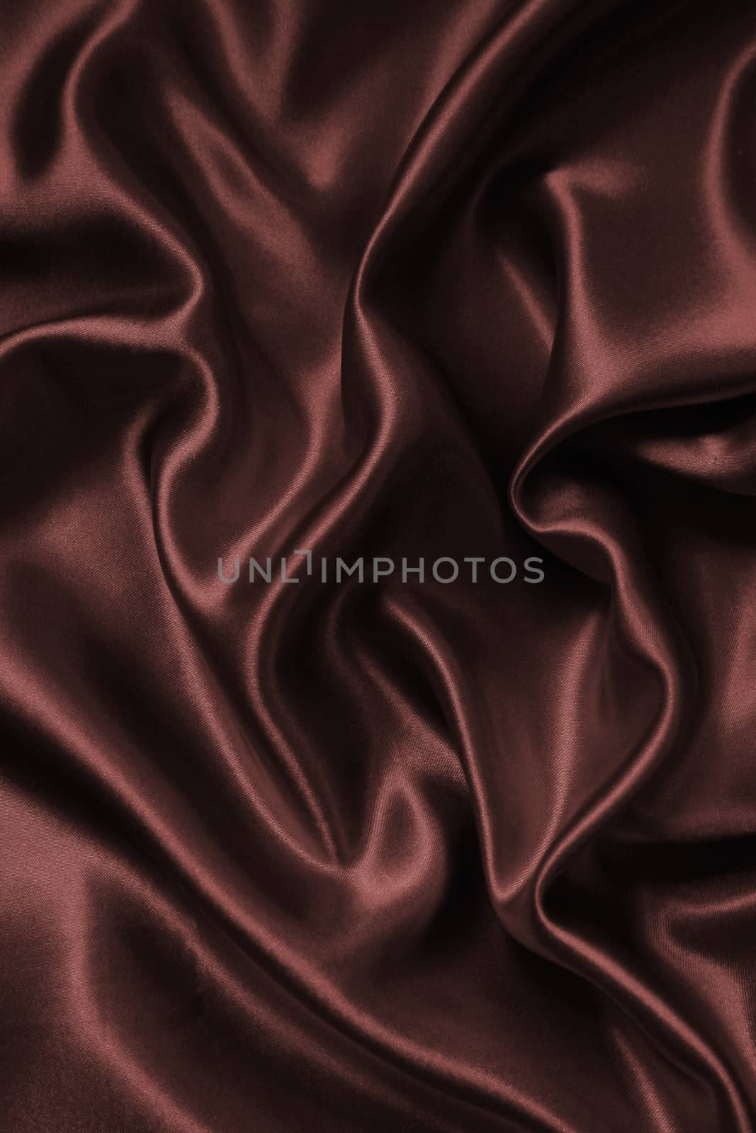 Smooth elegant brown chocolate silk as background  by oxanatravel