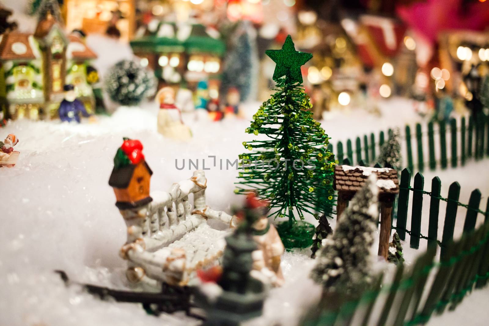 Miniature Christmas Village under Xmas Tree Closeup