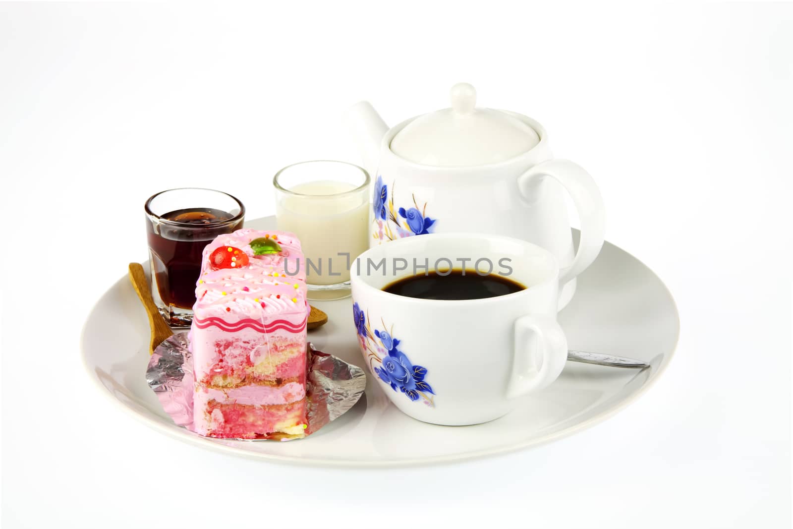 Cup of coffee, milk, honey and strawberry cake with poppy on white background