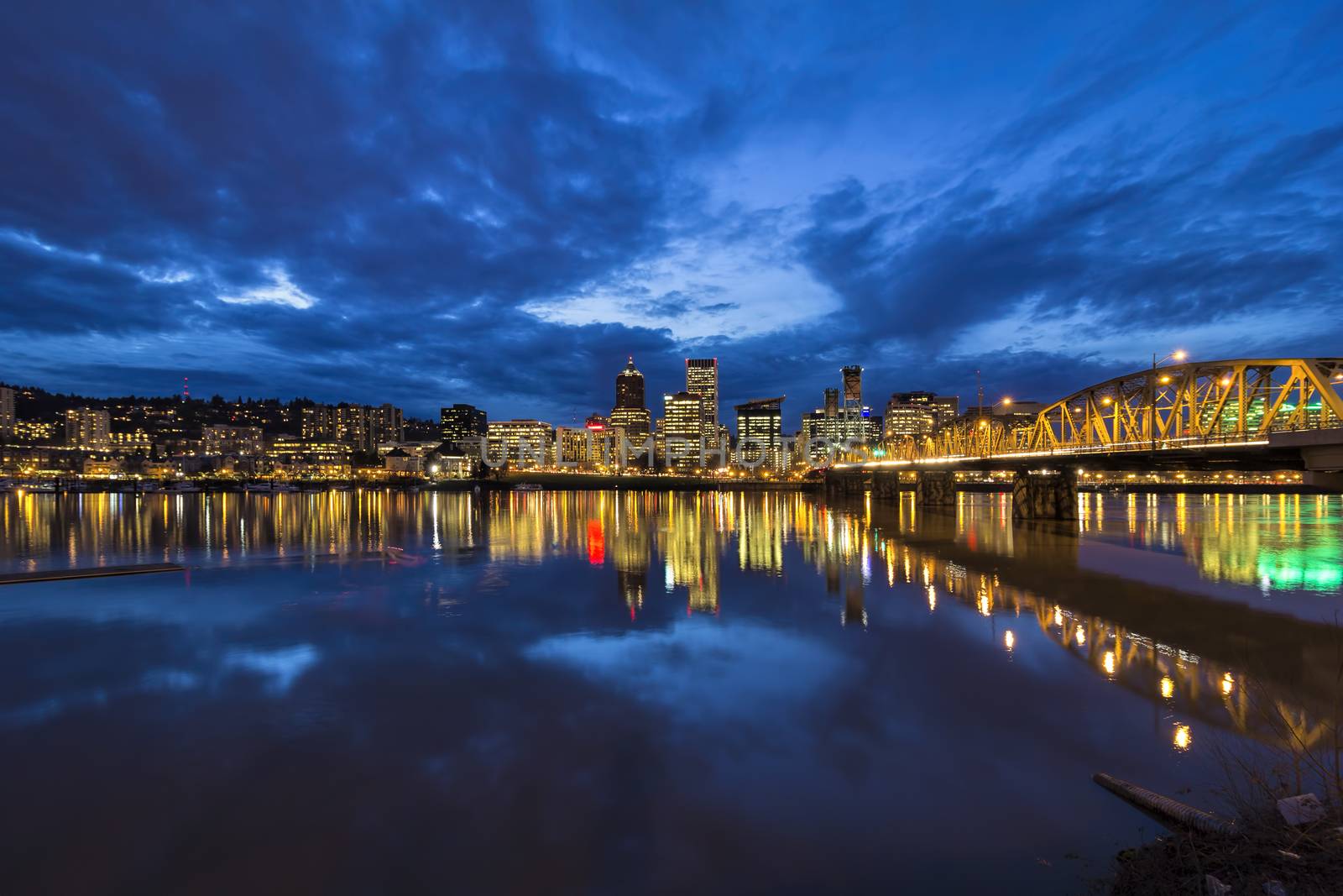 Hawthorne Bridge Over Willamette River to Portland Oregon Downtown City Skyline During Evening Blue Hour