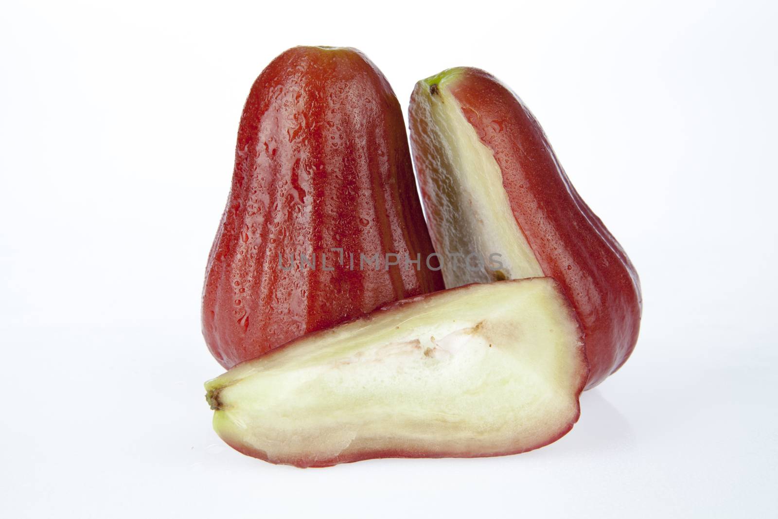 Two rose apple on a white background.