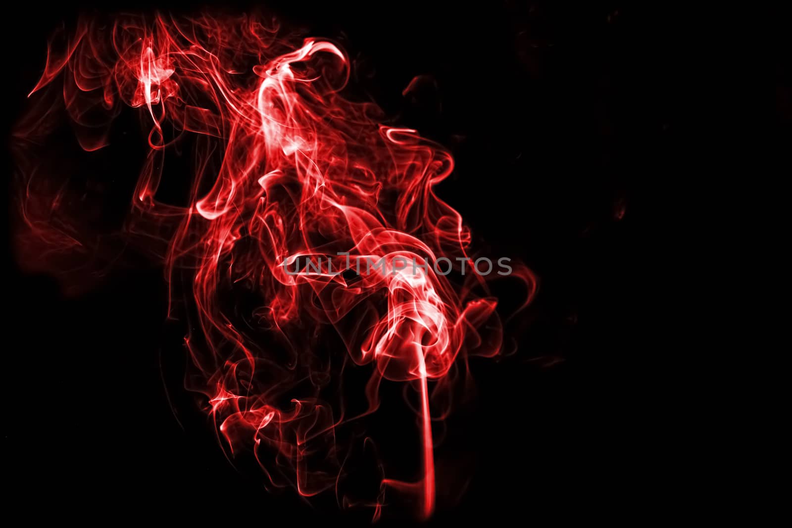 red smoke isolated on back background by Chattranusorn09