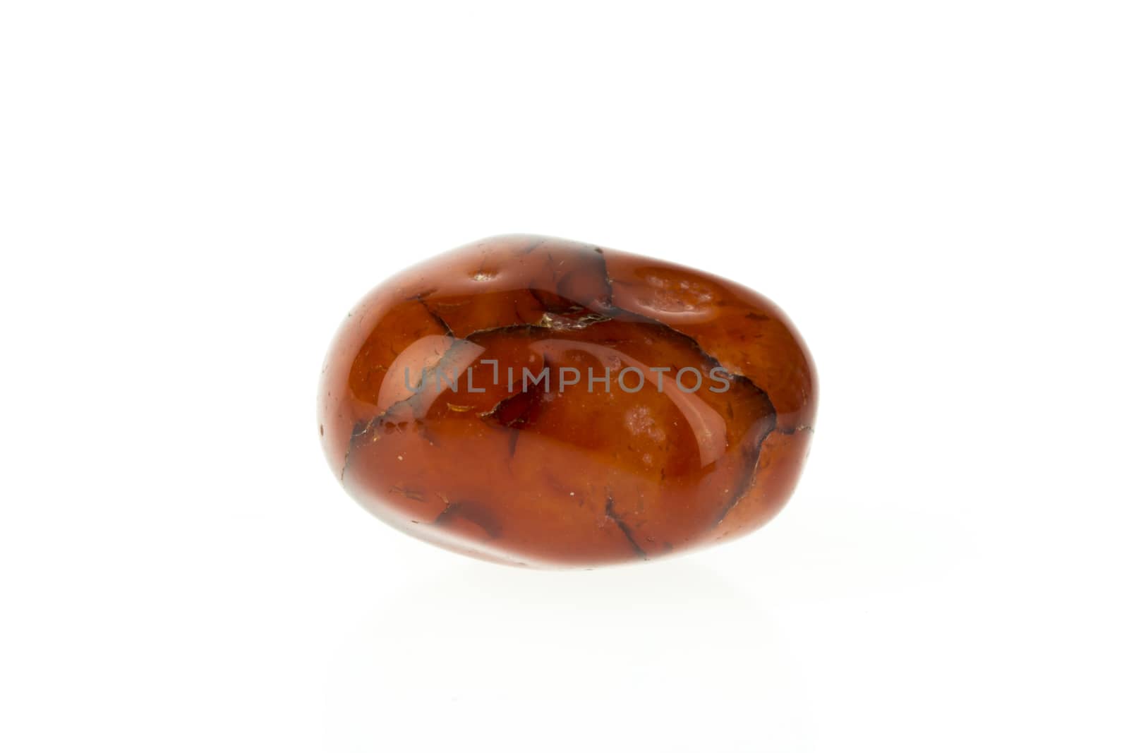 Red jasper stone on white background