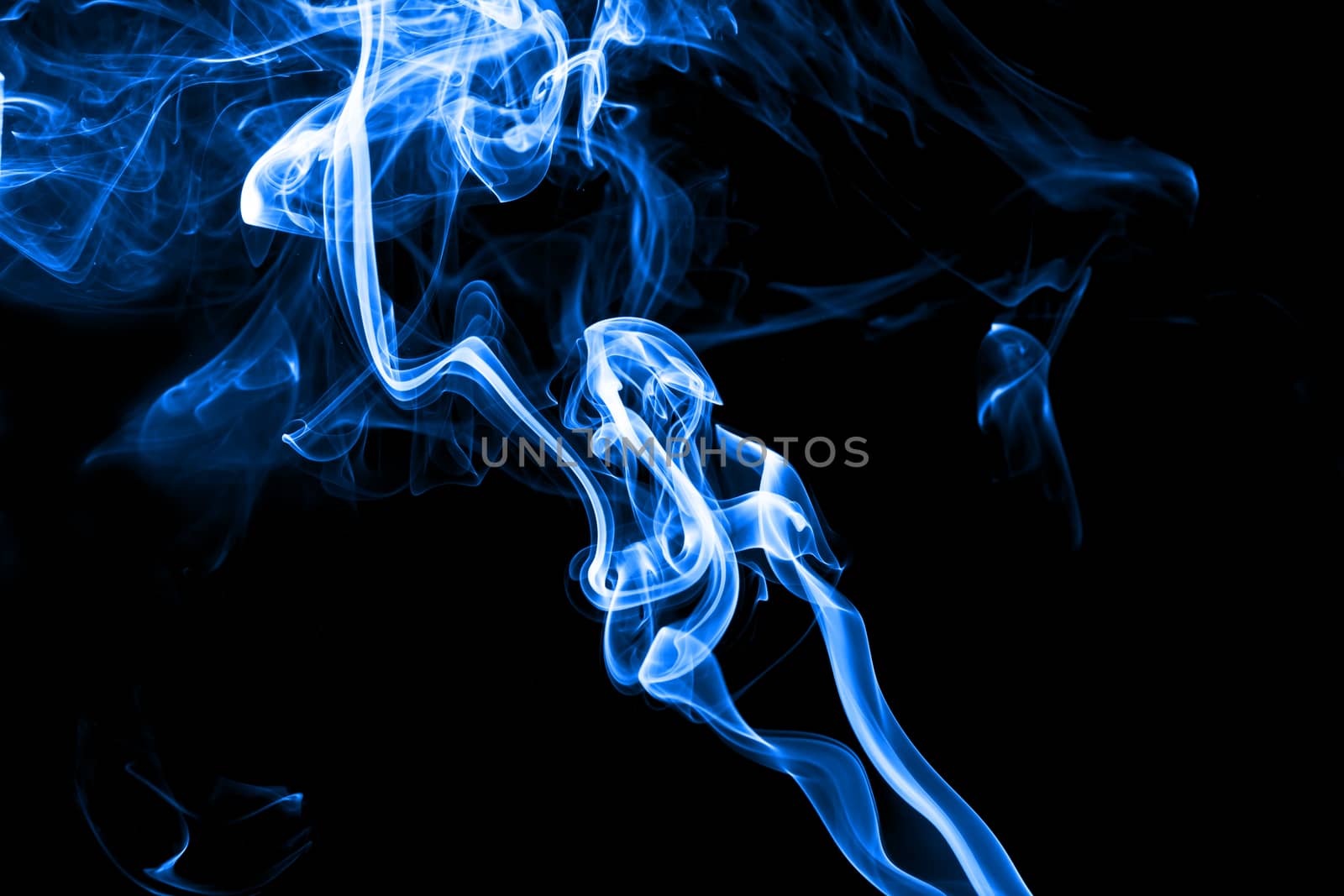 Blue smoke isolated with light on back background
