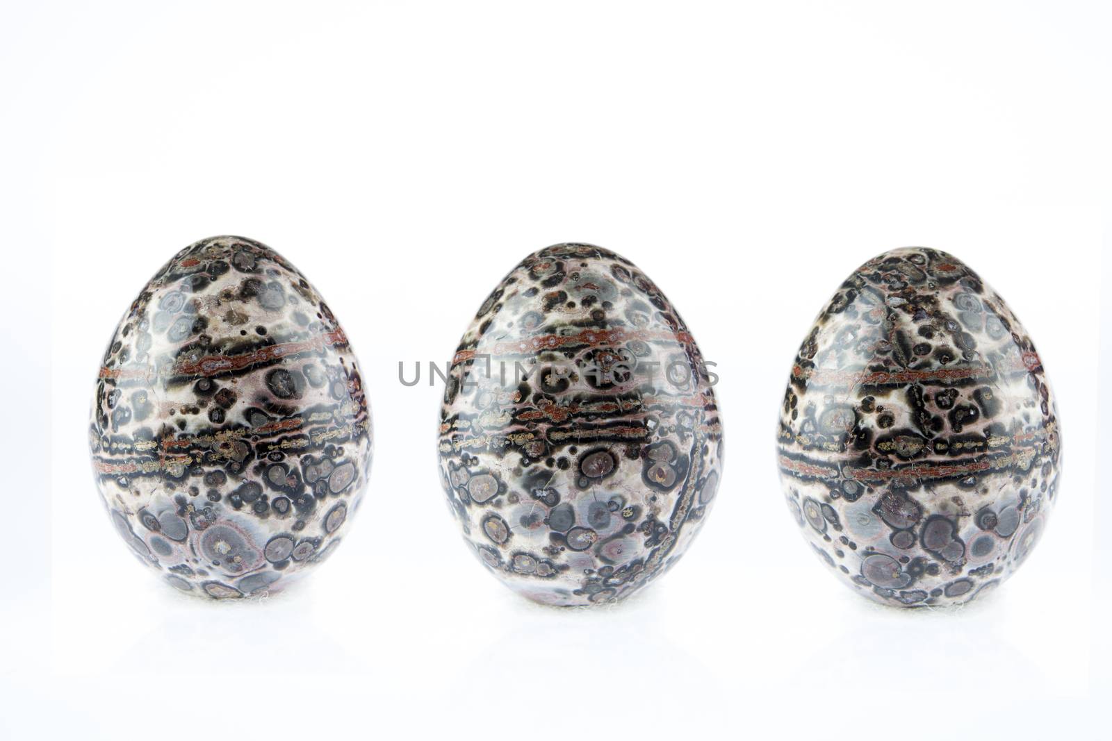 multicolored Agate stones egg shape on white background