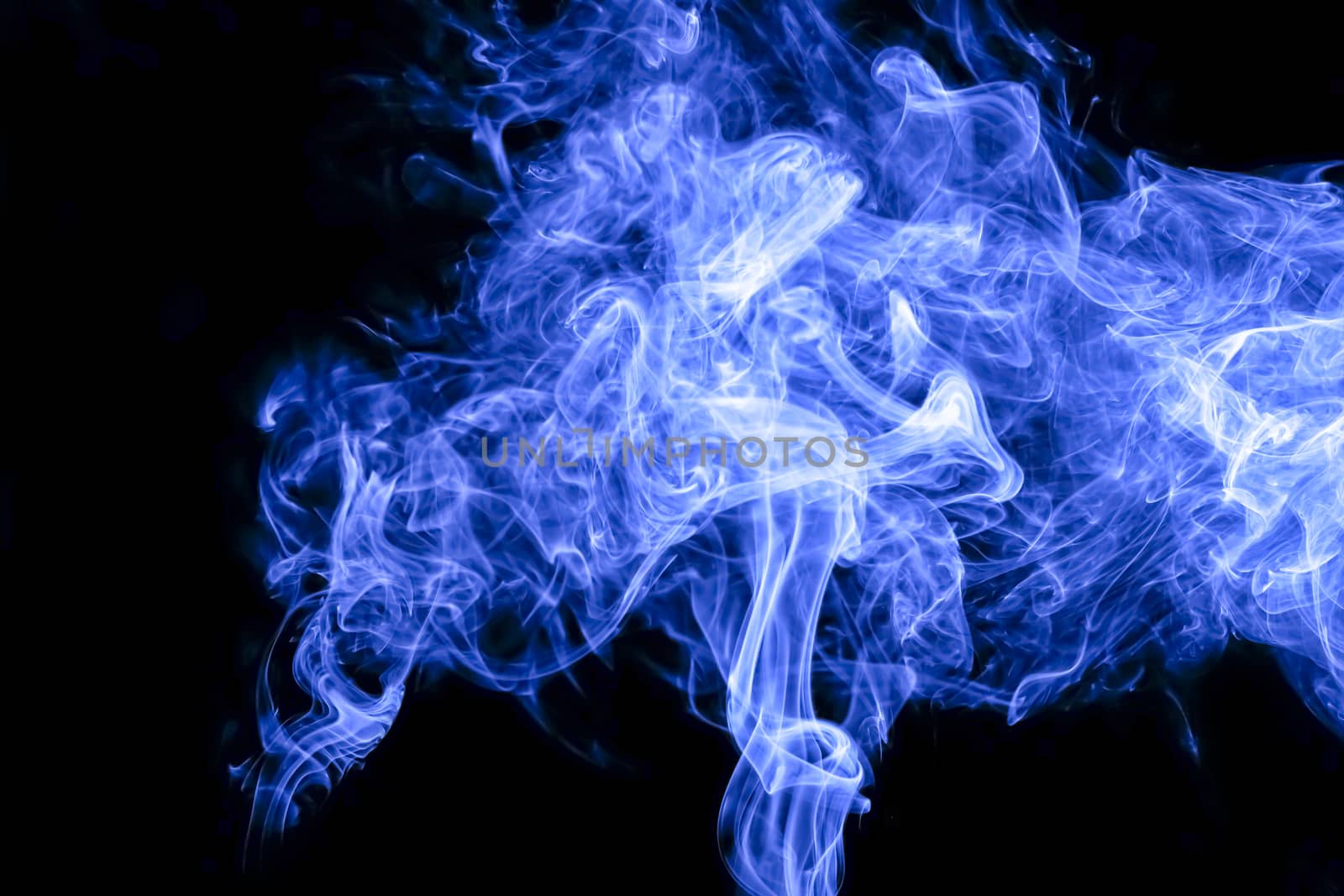 Blue smoke on black background