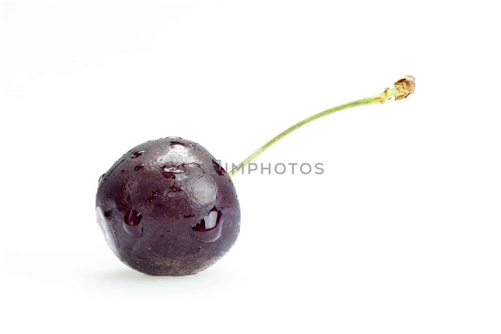 Single ripe cherry isolated on white background by Chattranusorn09