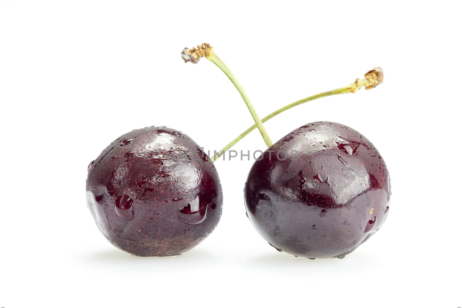 Two cherry berries on white background by Chattranusorn09