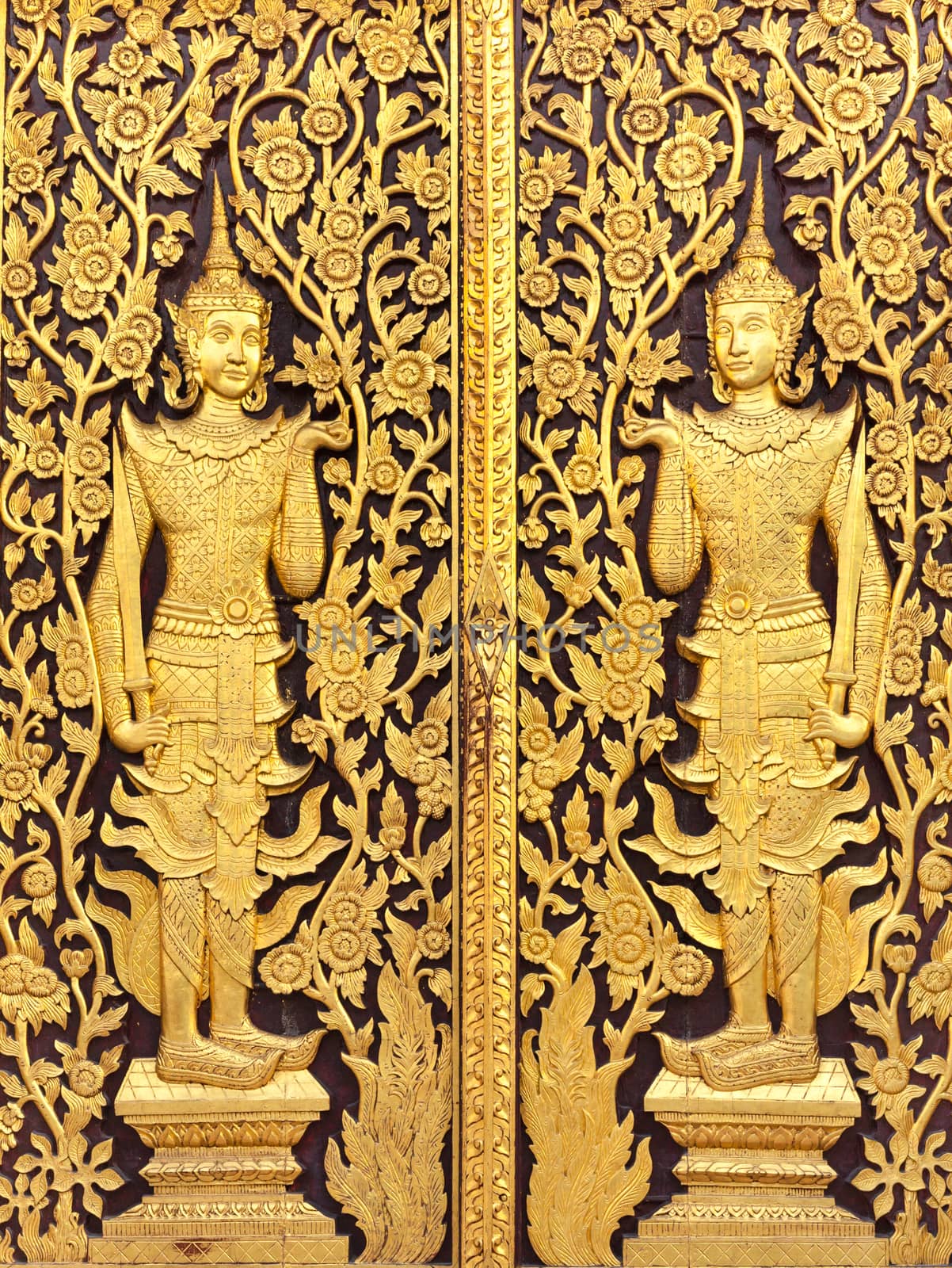 Thai culture gold sculpture on the temple wall by nopparats