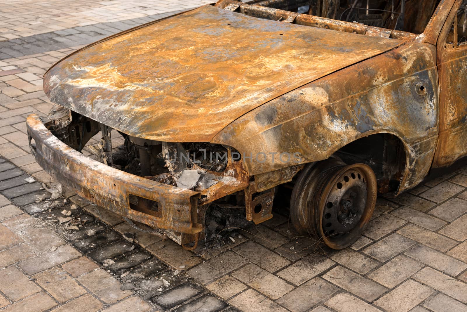 front of burnt out abandoned car