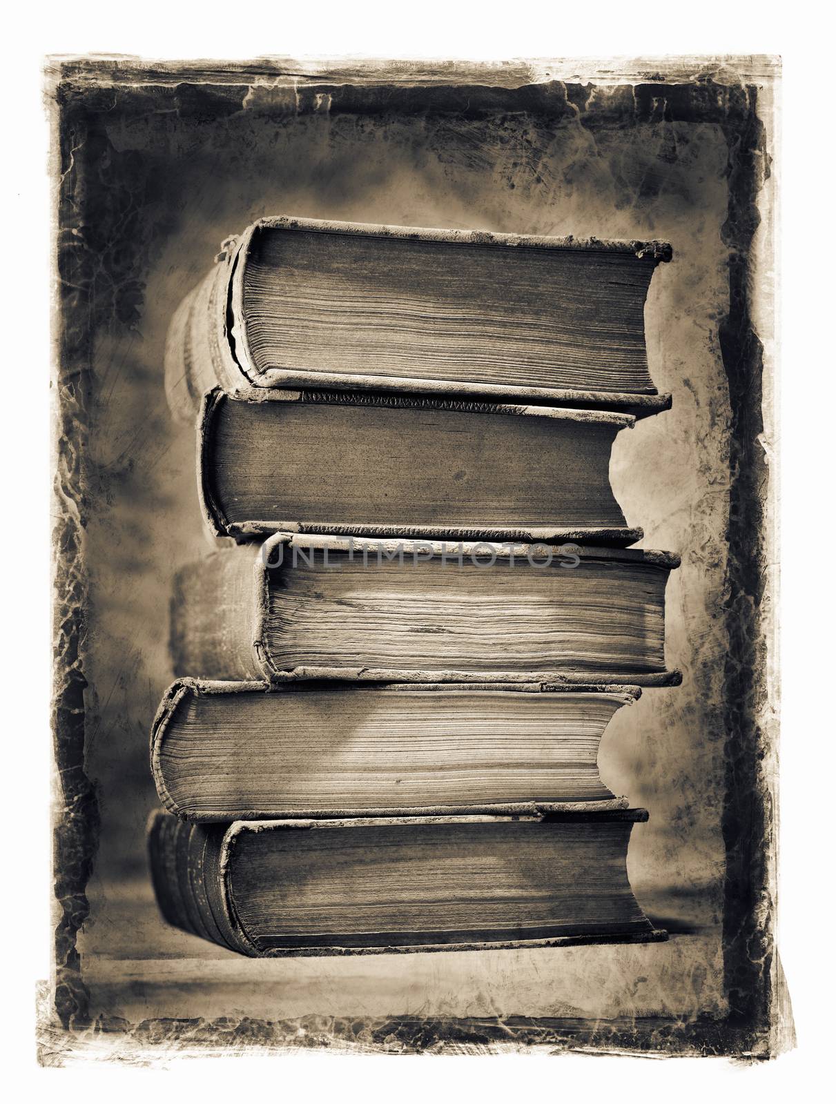 Dirty and stained image of a stack of old books.