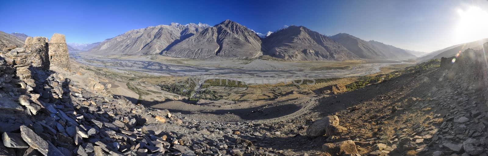 Scenic panorama of valley on arid landscape in Tajikistan on sunny day