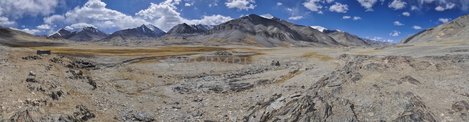 Scenic panorama of cold arid landscape in Tajikistan on sunny day