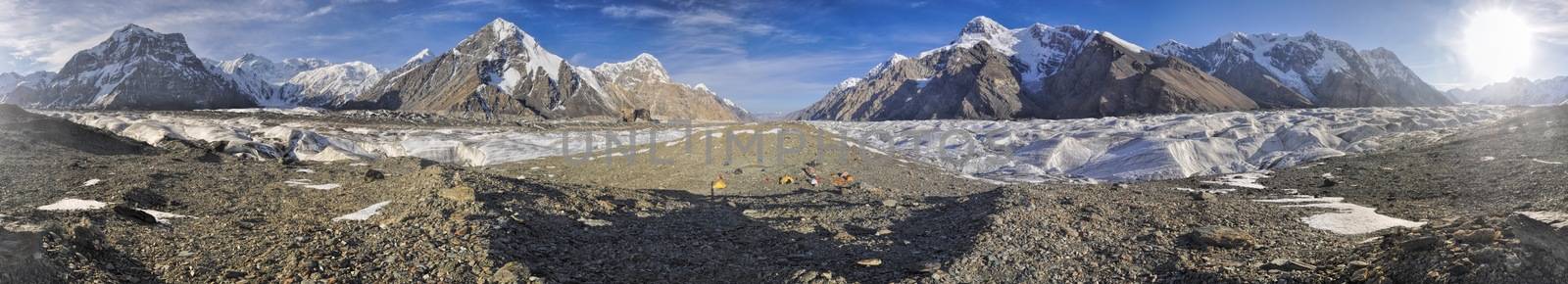 Scenic panorama of campsite on Engilchek glacier in picturesque Tian Shan mountain range in Kyrgyzstan