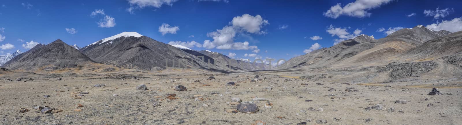 Scenic panorama of cold arid landscape in Tajikistan on sunny day