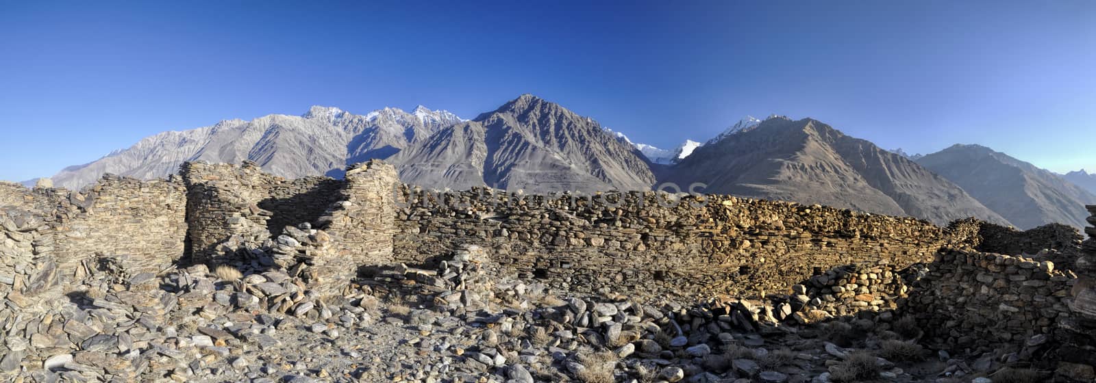 Scenic panorama of old ruins on arid landscape in Tajikistan on sunny day