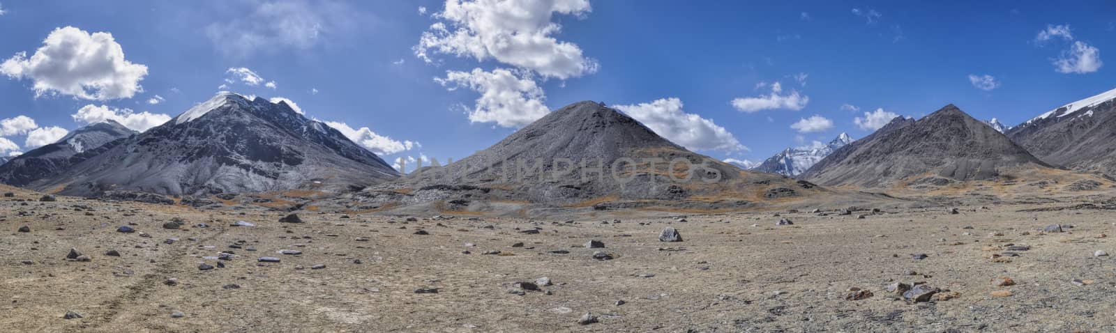 Scenic panorama of cold arid landscape in Tajikistan on sunny day