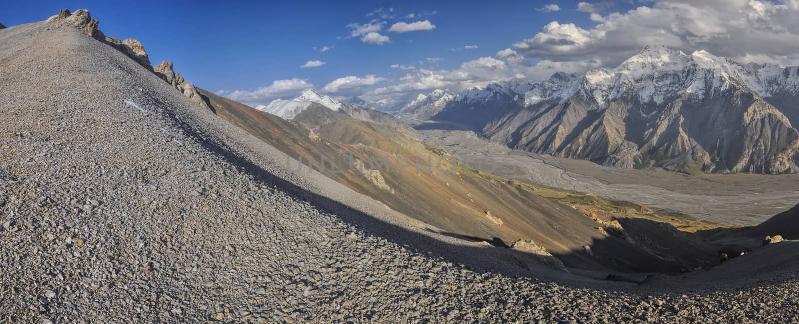 Scenic panorama of valley and mountain peaks in Tien-Shan mountain range in Kyrgyzstan