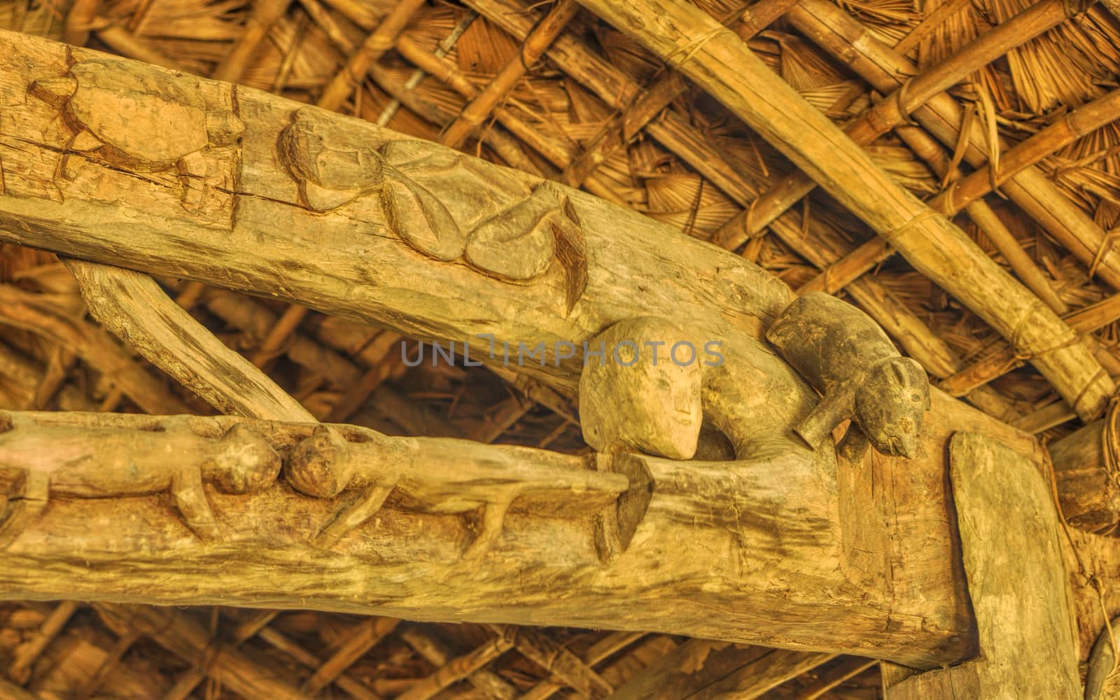 Interior detail of a traditional wooden dwelling with carved symbols in India