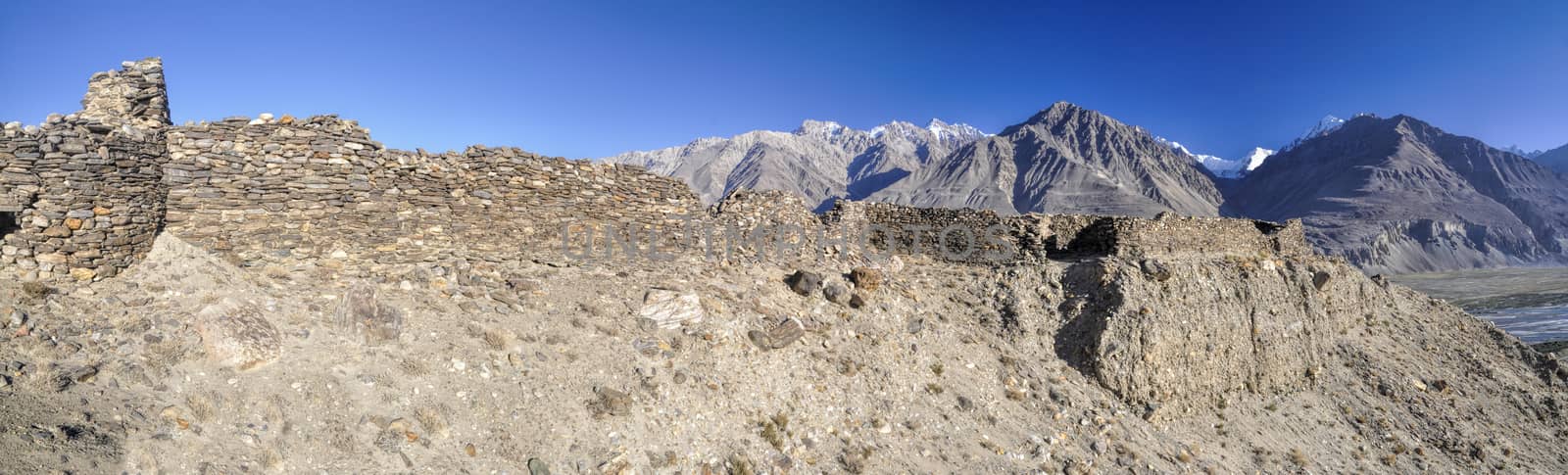 Scenic panorama of old ruins on arid landscape in Tajikistan on sunny day