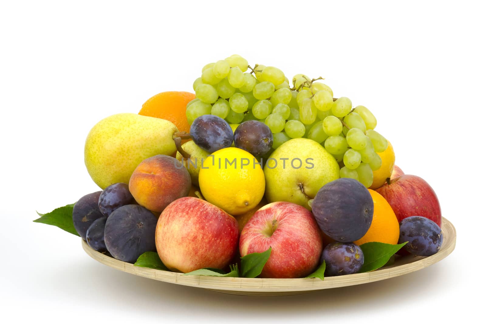 fresh fruits on a plate by miradrozdowski