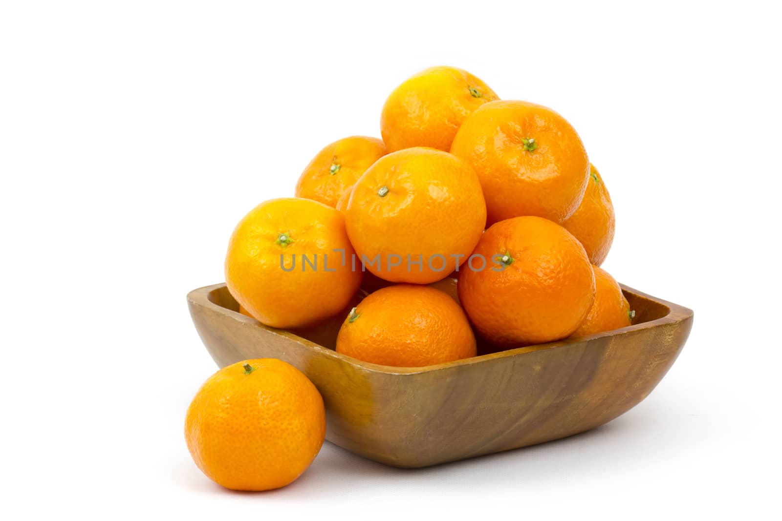 tangerines in a bowl on white background by miradrozdowski