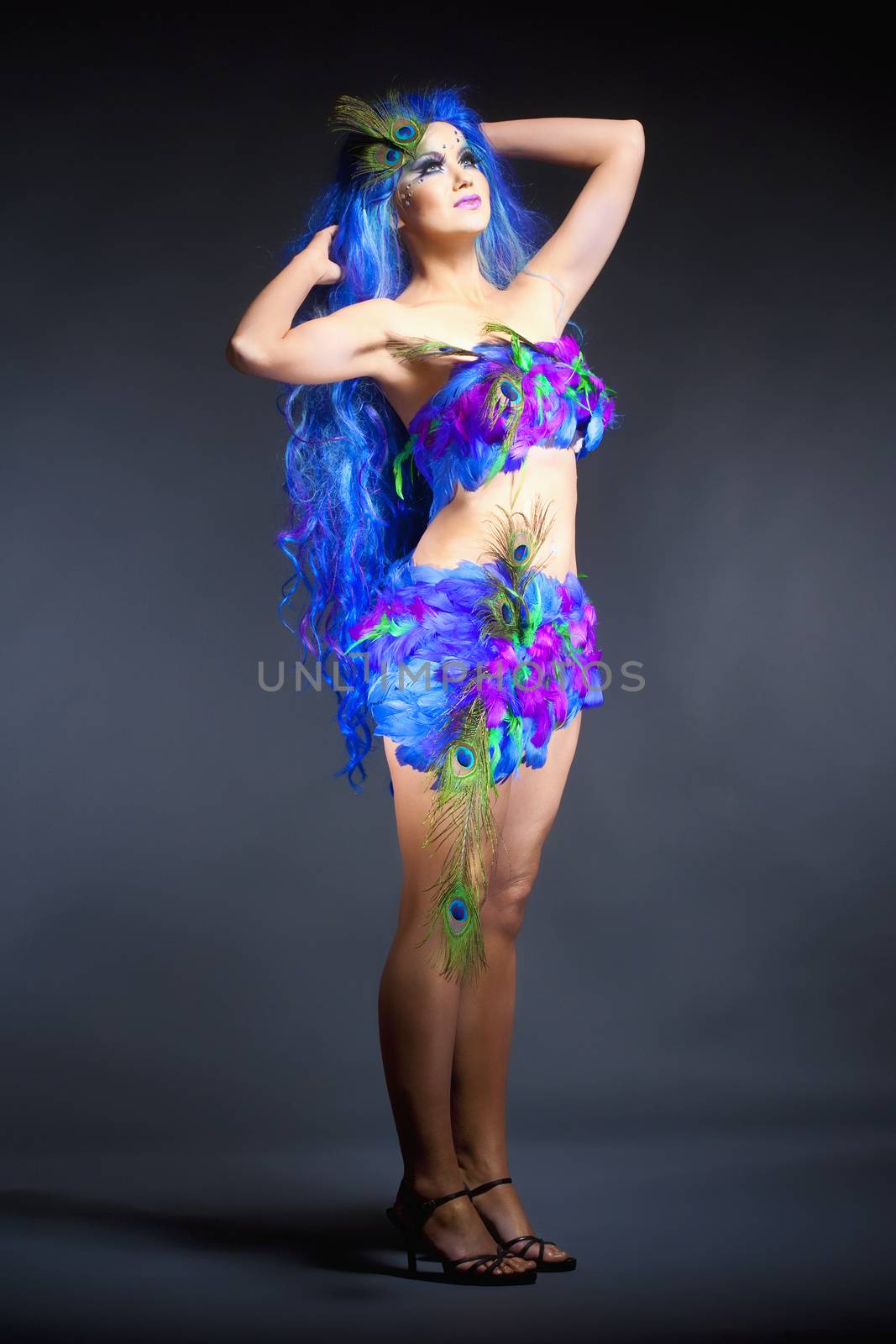 Young Woman in Blue Wig and Dress of Feathers