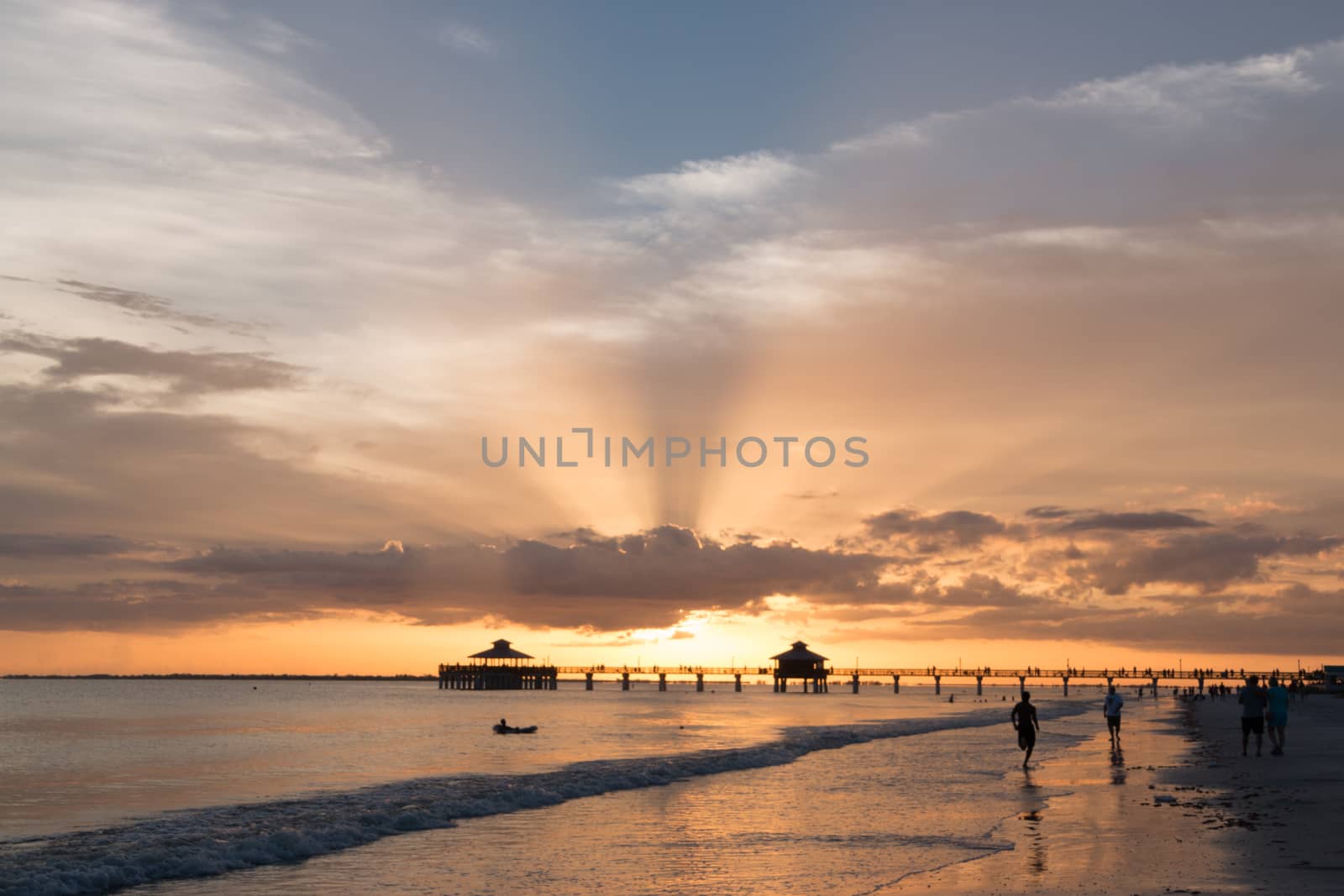 The beautiful sun setting on the shores of Fort Myers Beach located on Estero Island in Florida, United States of America