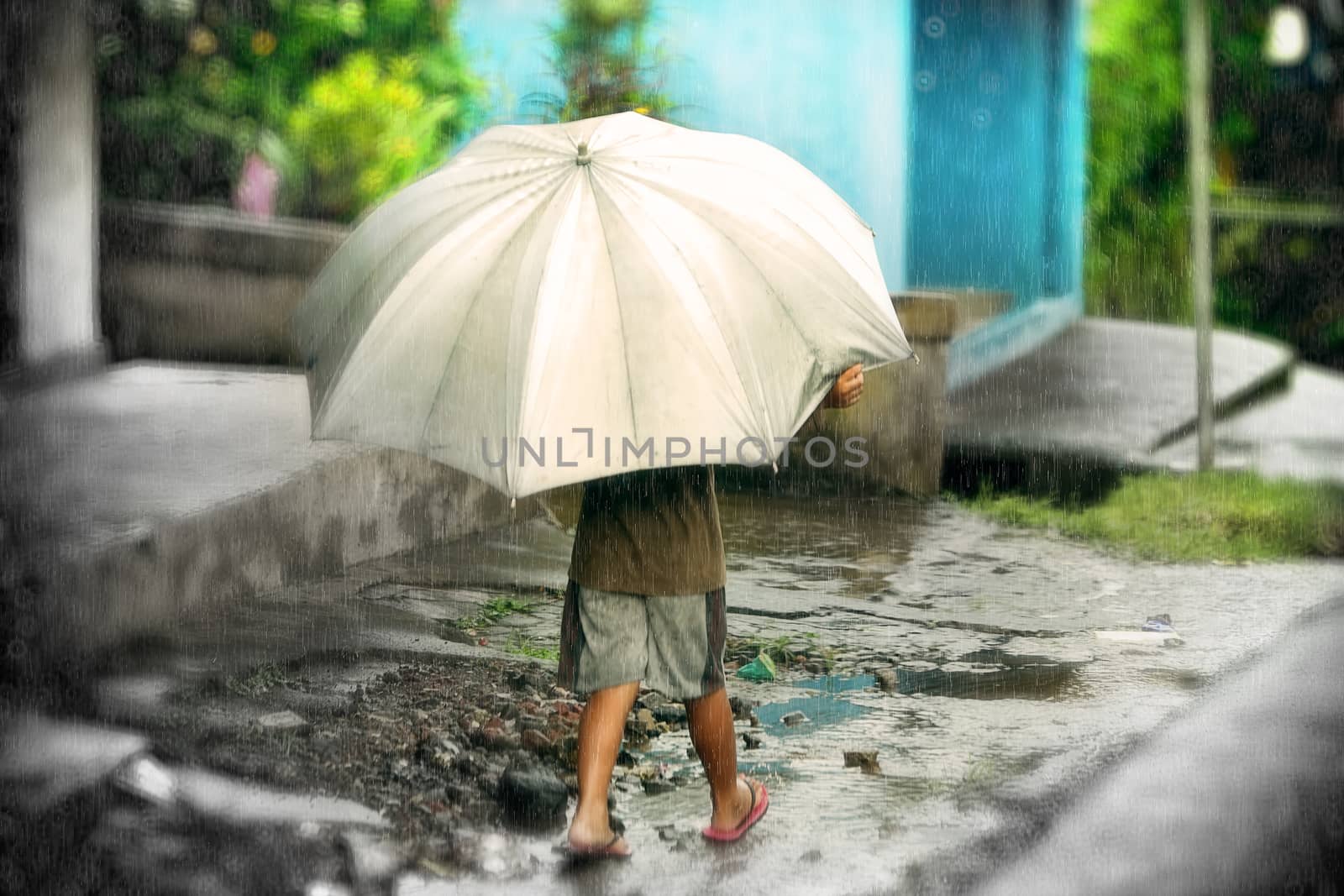 littel boy with umbrella