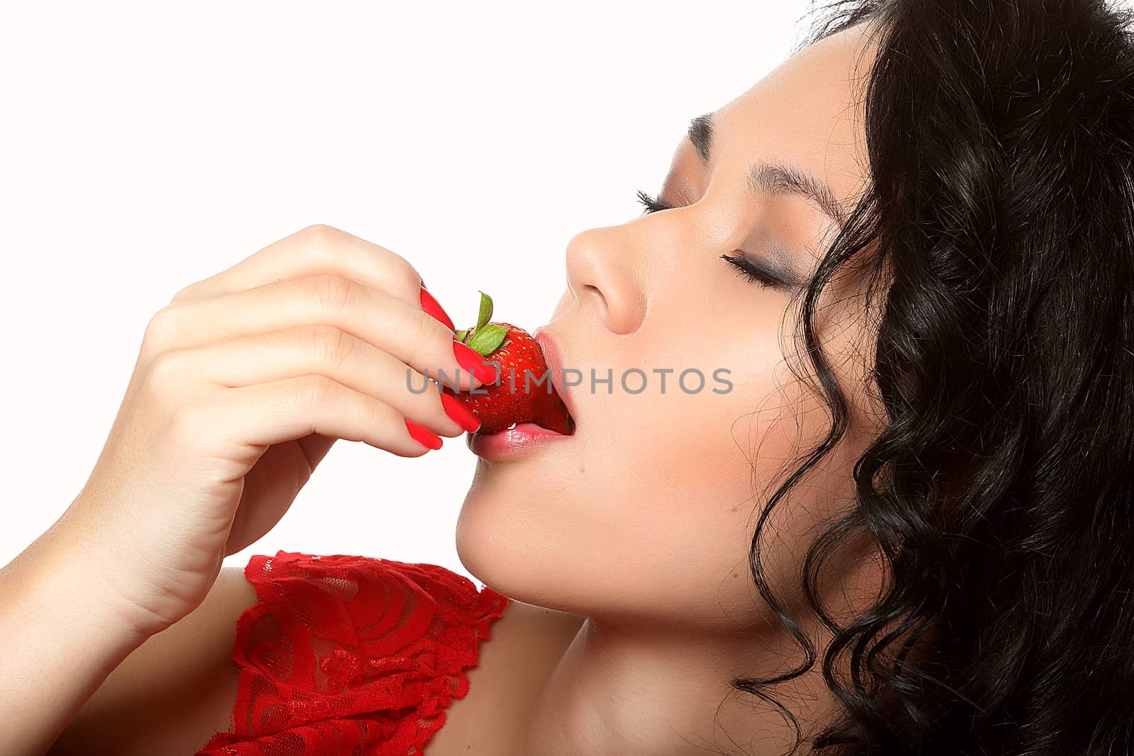 pretty woman eats strawberry