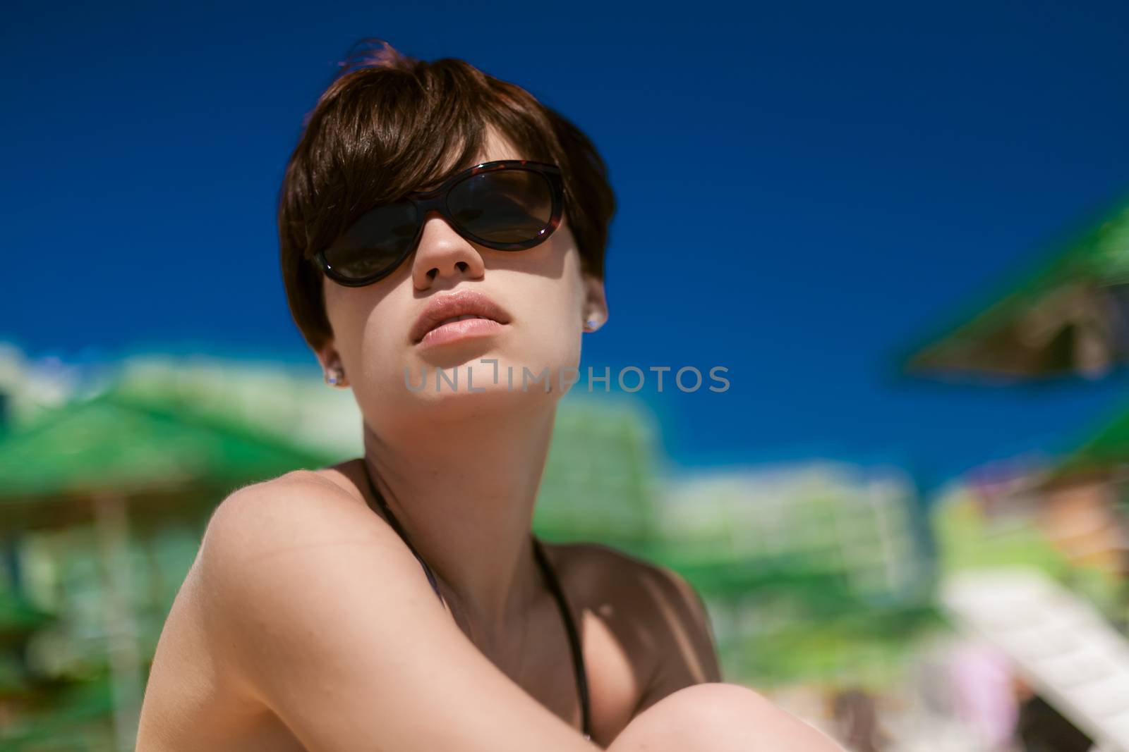 Sexy young woman on the beach by sarymsakov