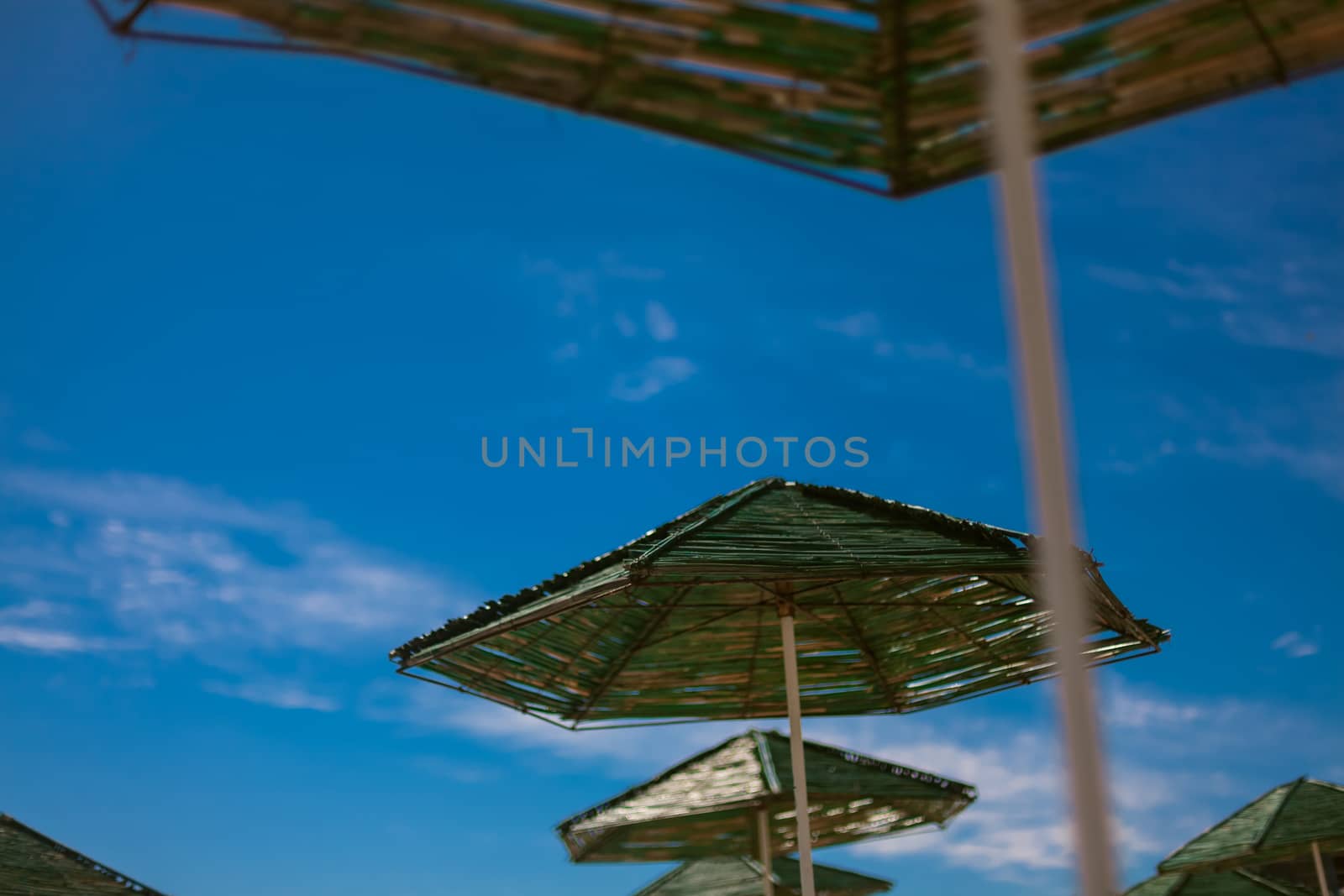 beach with parasol by sarymsakov