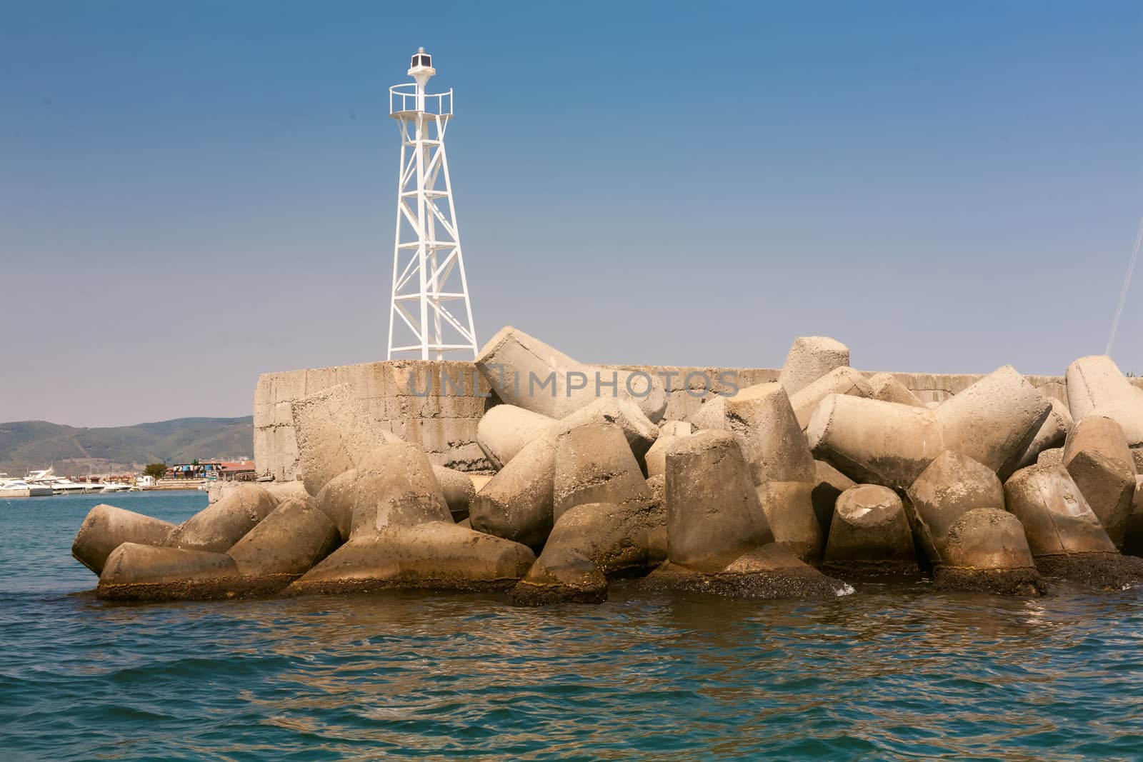 The breakwaters on the shore blue sea