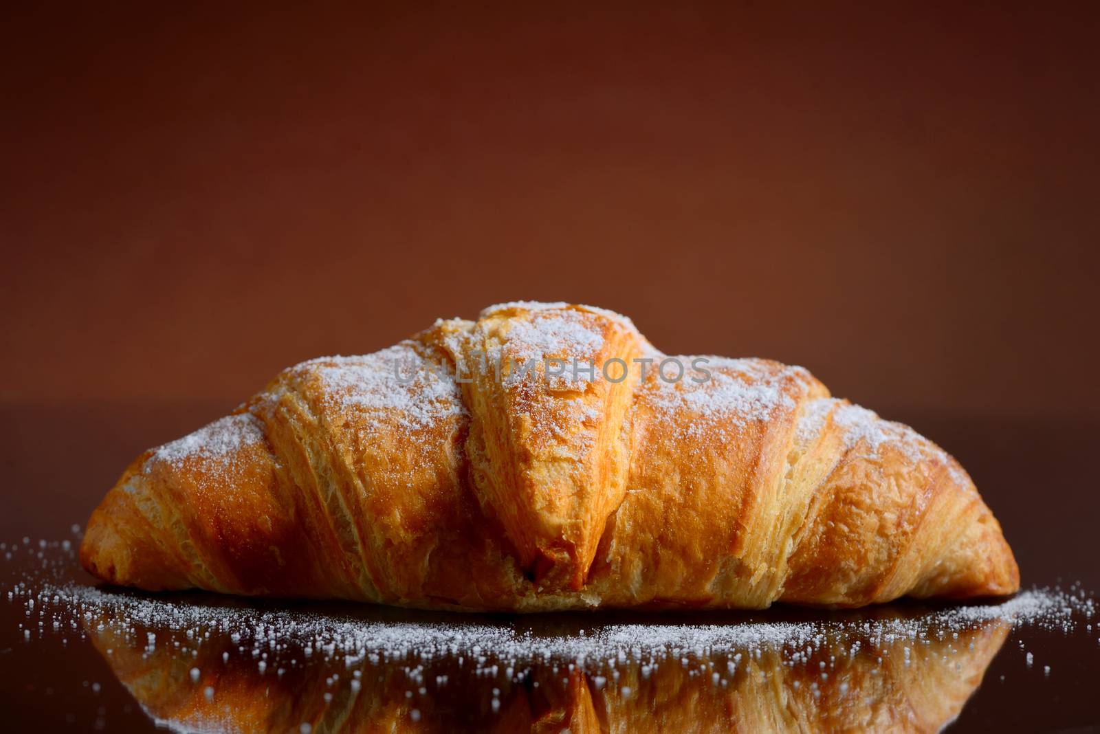 Fresh baked croissant with sugar