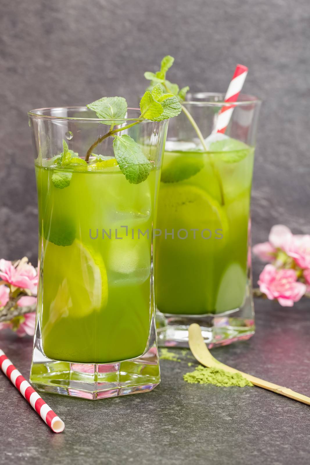 Healthy Iced Matcha Tea with lime, ginger and mint. Macro, selective focus
