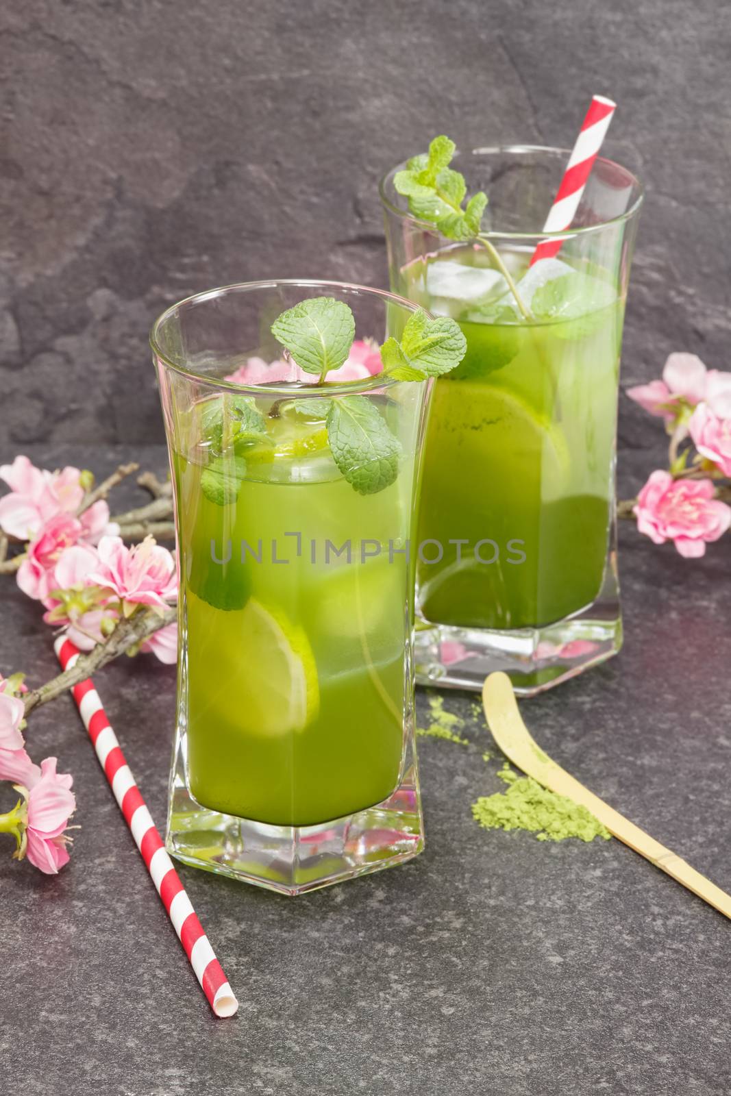 Healthy Iced Matcha Tea with lime, ginger and mint. Macro, selective focus
