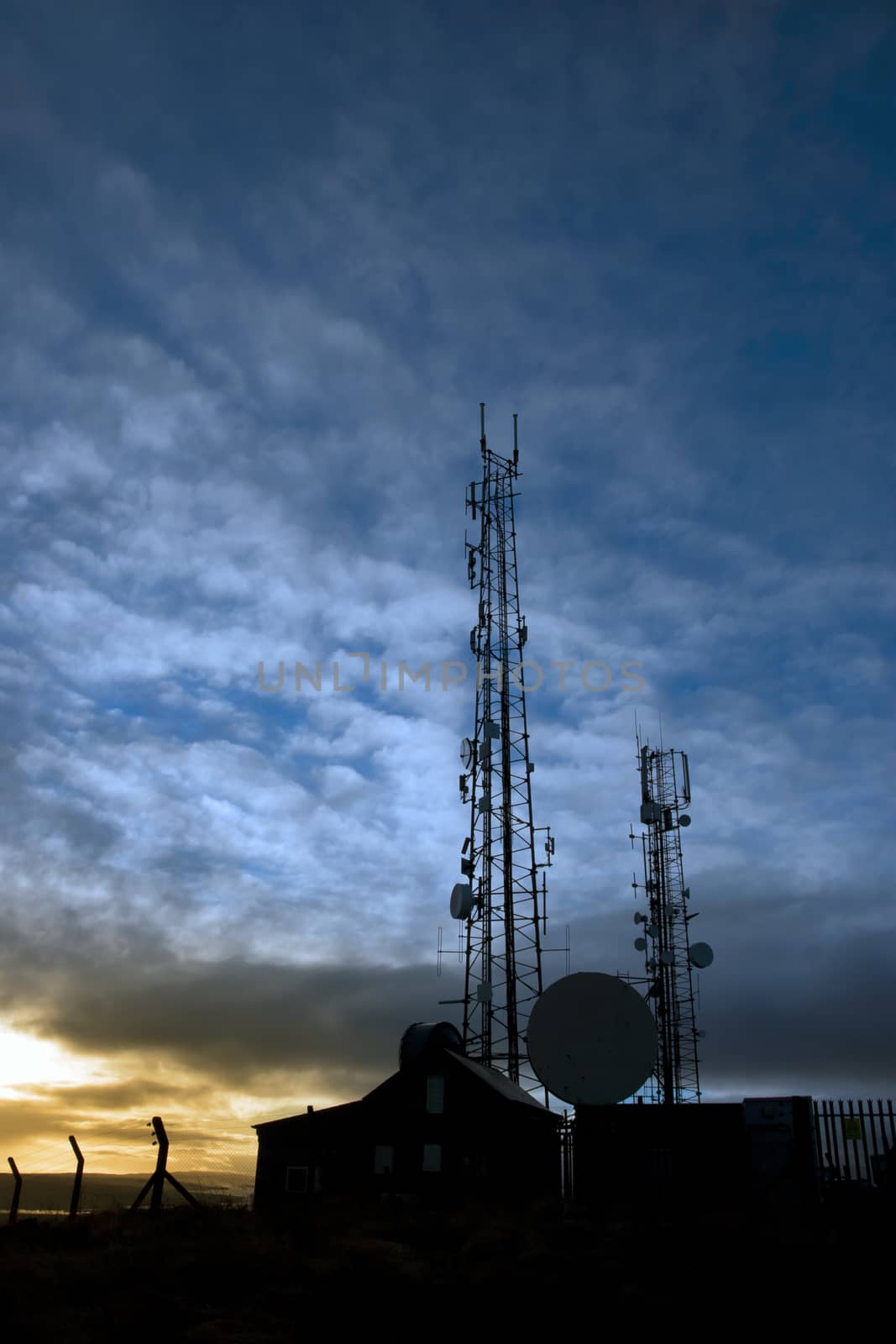 transmission tower on Knockanore hill at dusk by morrbyte