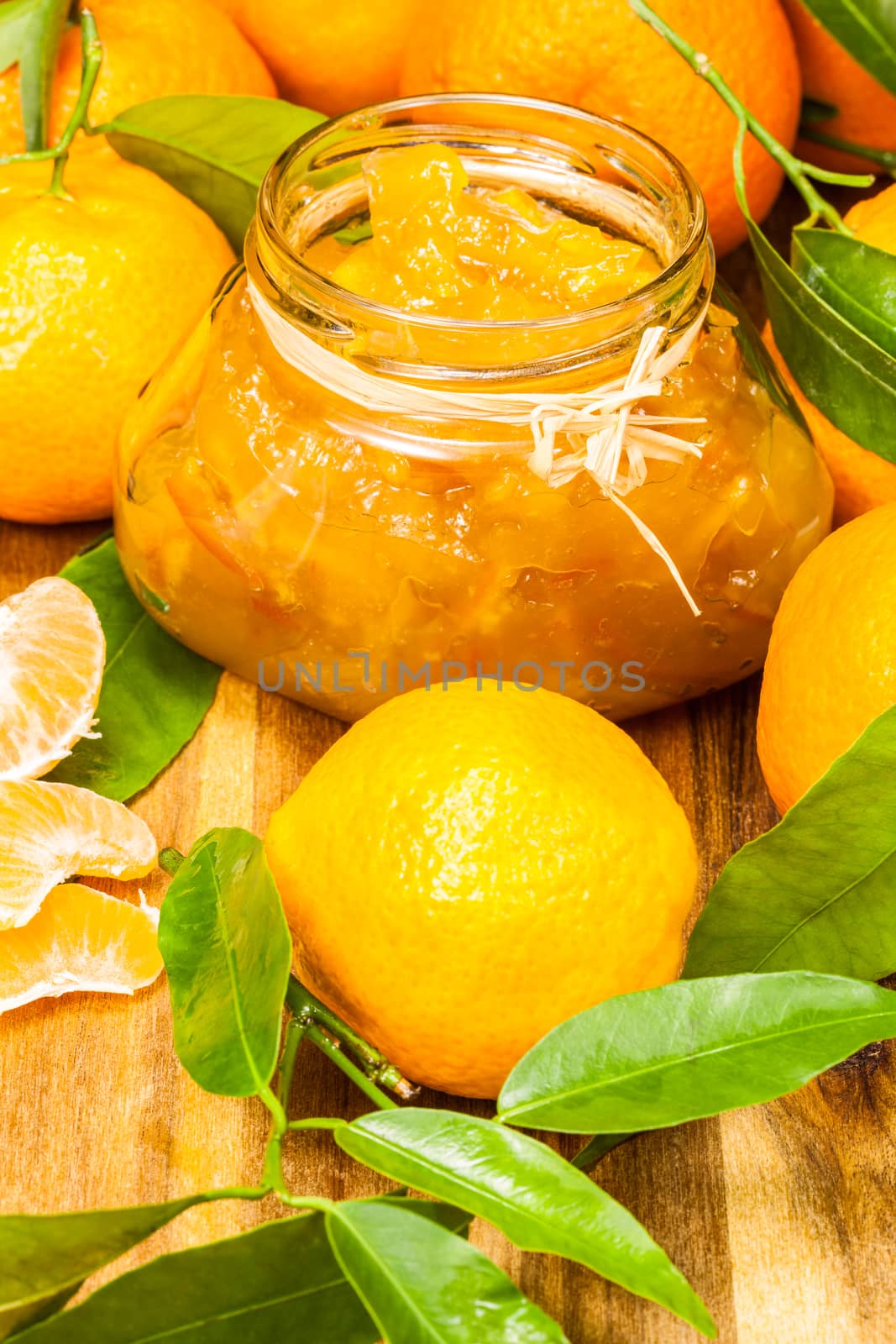 orange mandarin homemade jam in a glass jar