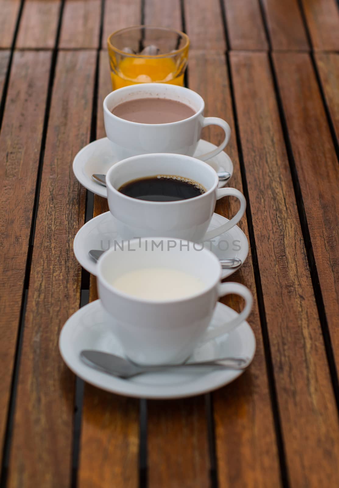 Cup of milk, coffee, chocolate and orange juice