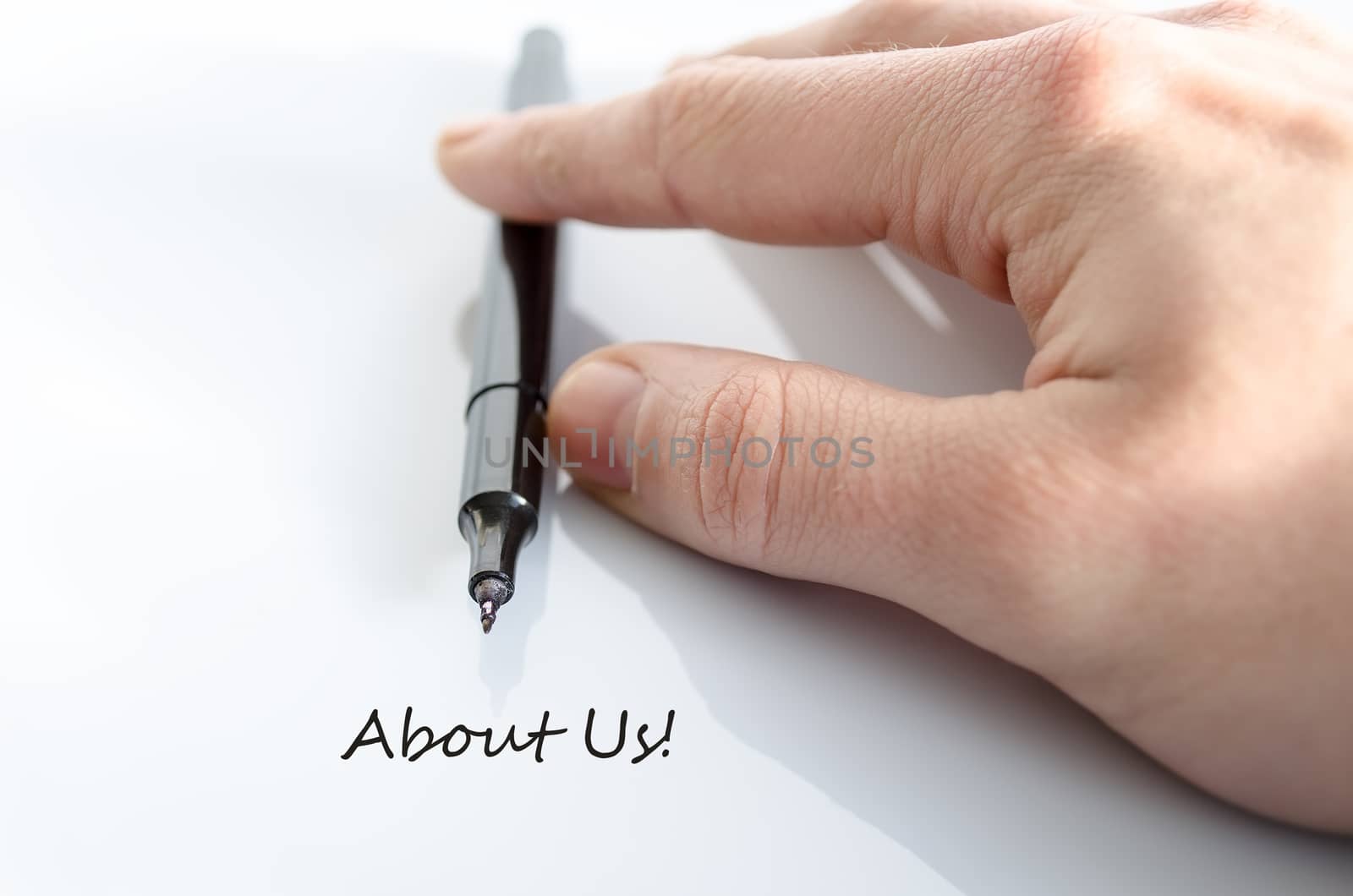 Pen in the hand isolated over white background