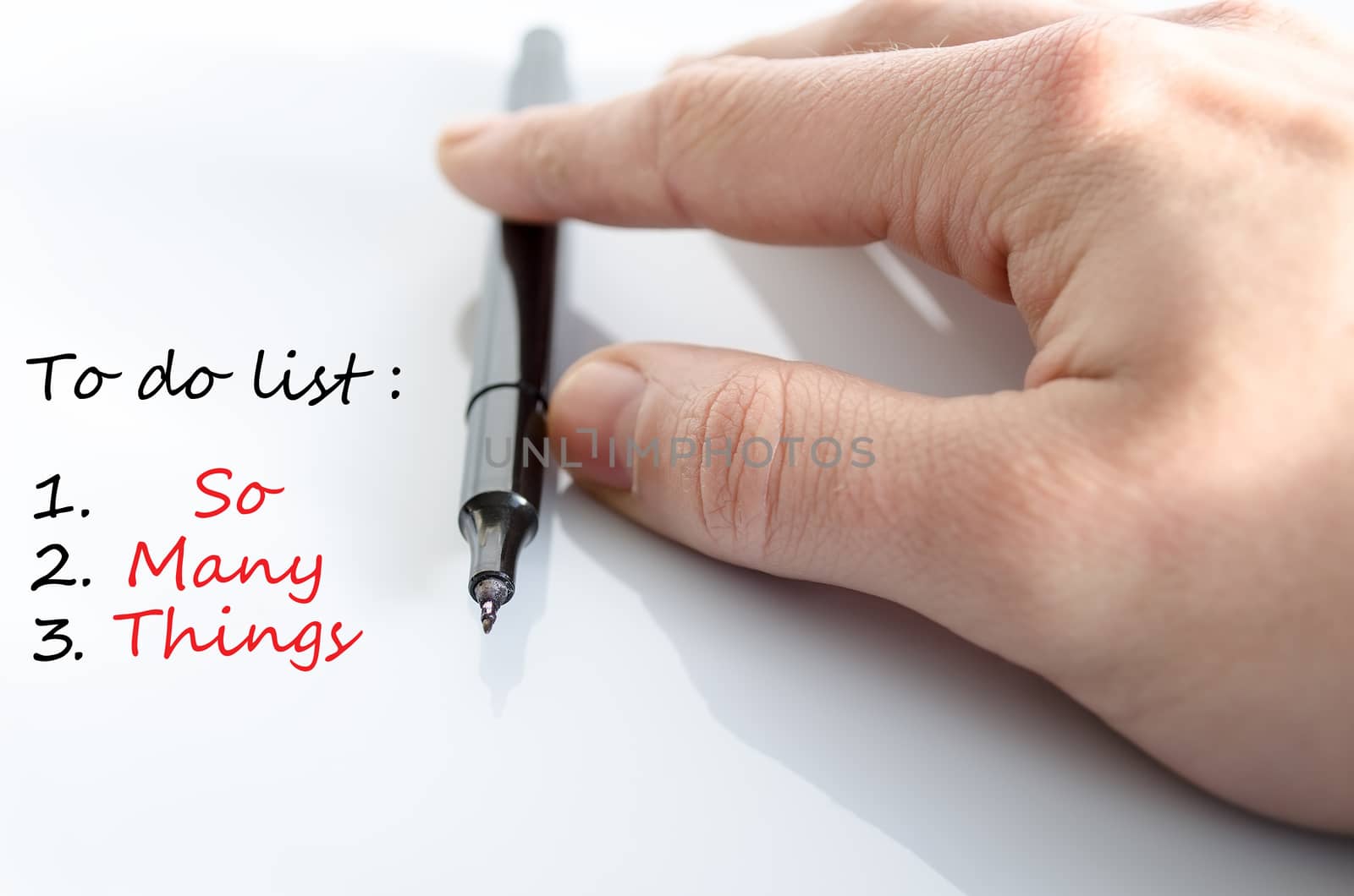 Pen in the hand isolated over white background