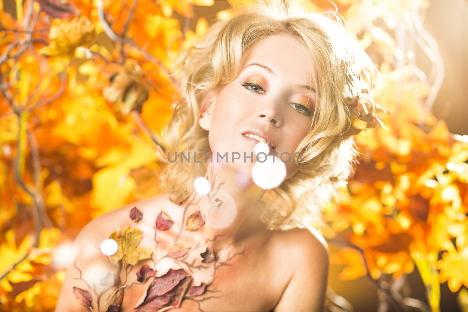 Fragile woman in autumn sun golden bubbles bizzare