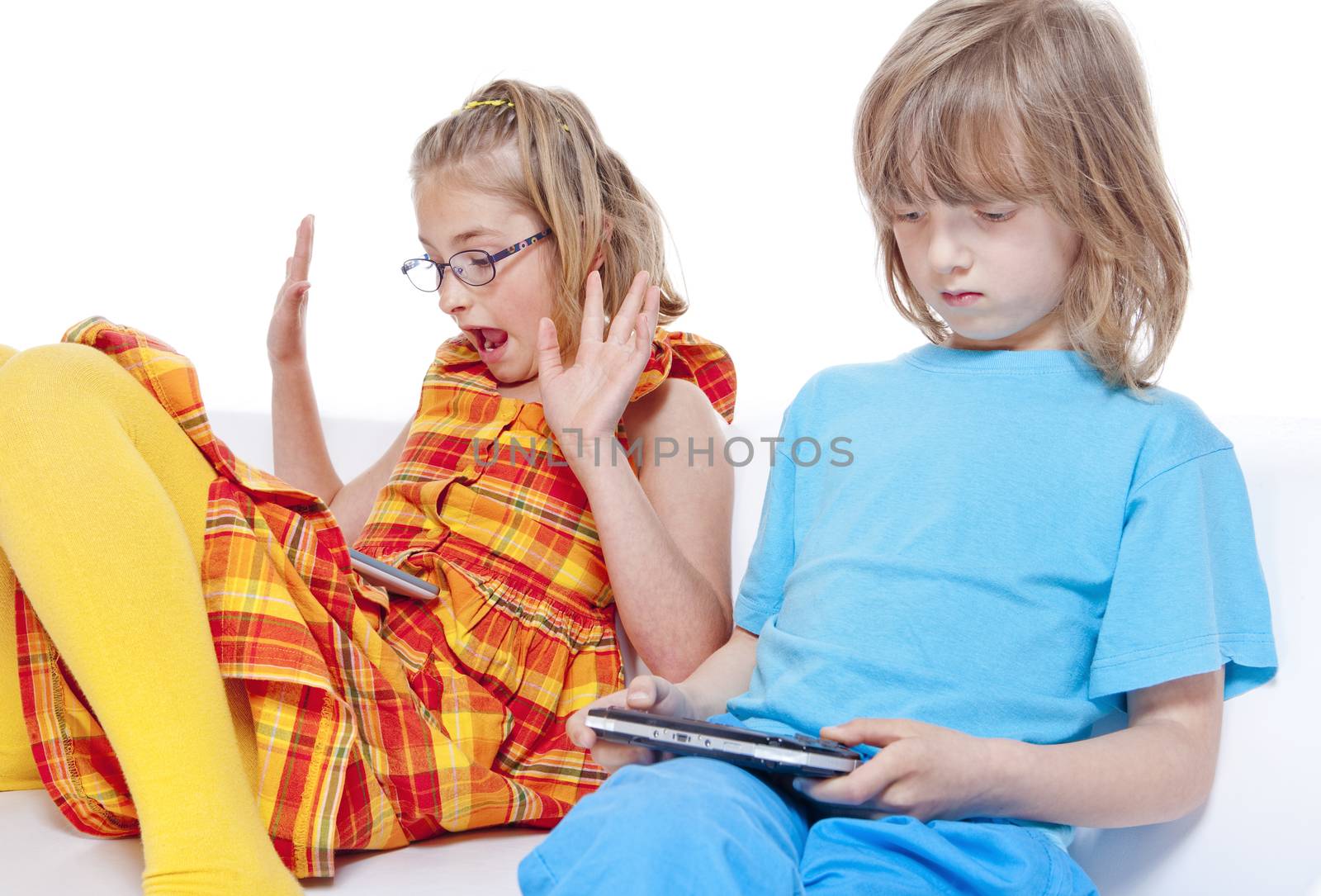 Two Children Having Fun with Digital Gadgets - Isolated on White